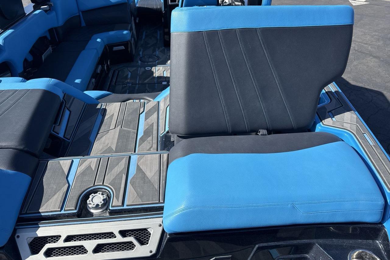 2021 Supra SA 450 boat interior with blue and black seating, modern design.