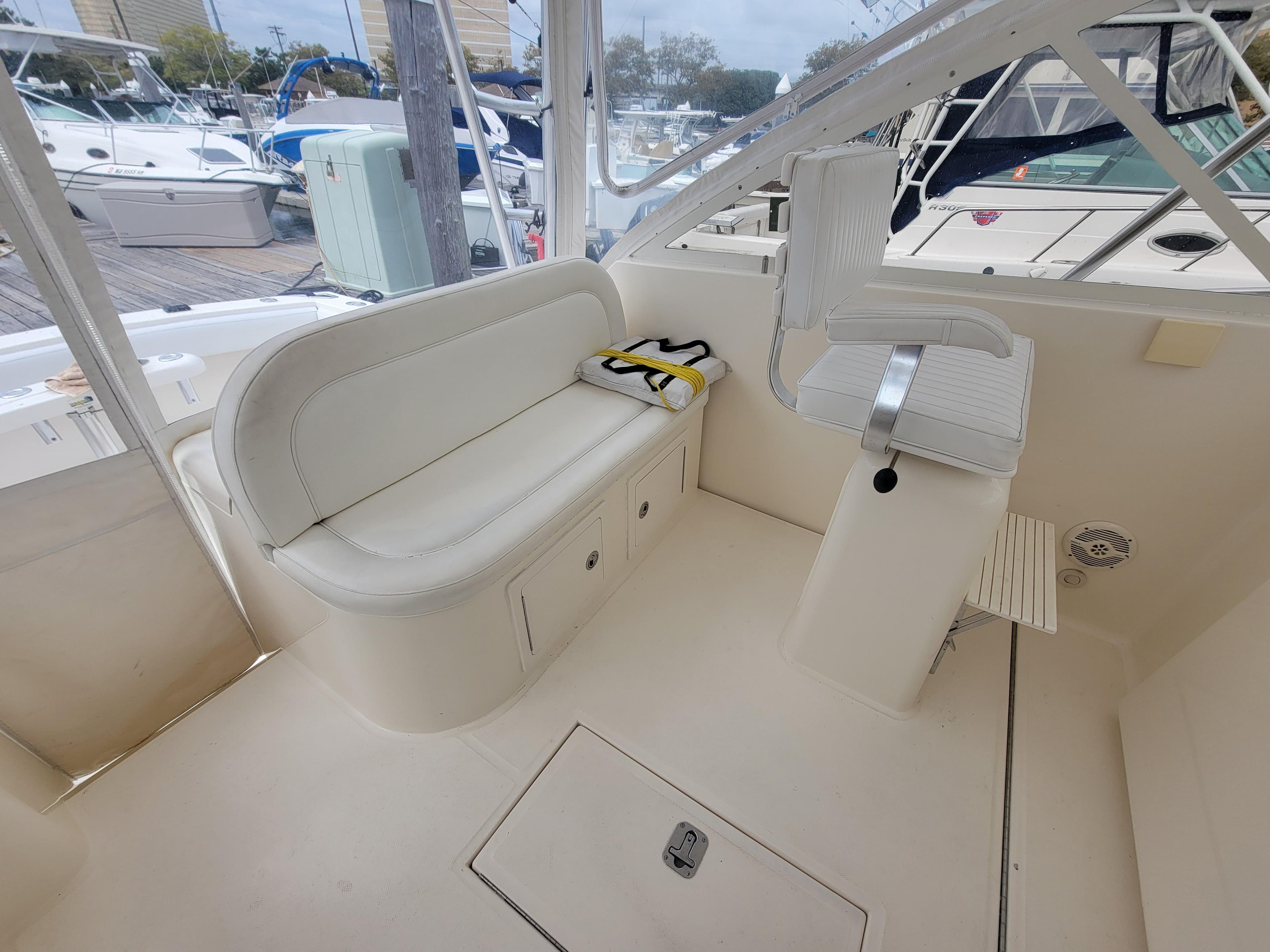 2006 Carolina Classic 32 Express boat interior with seating and helm station.