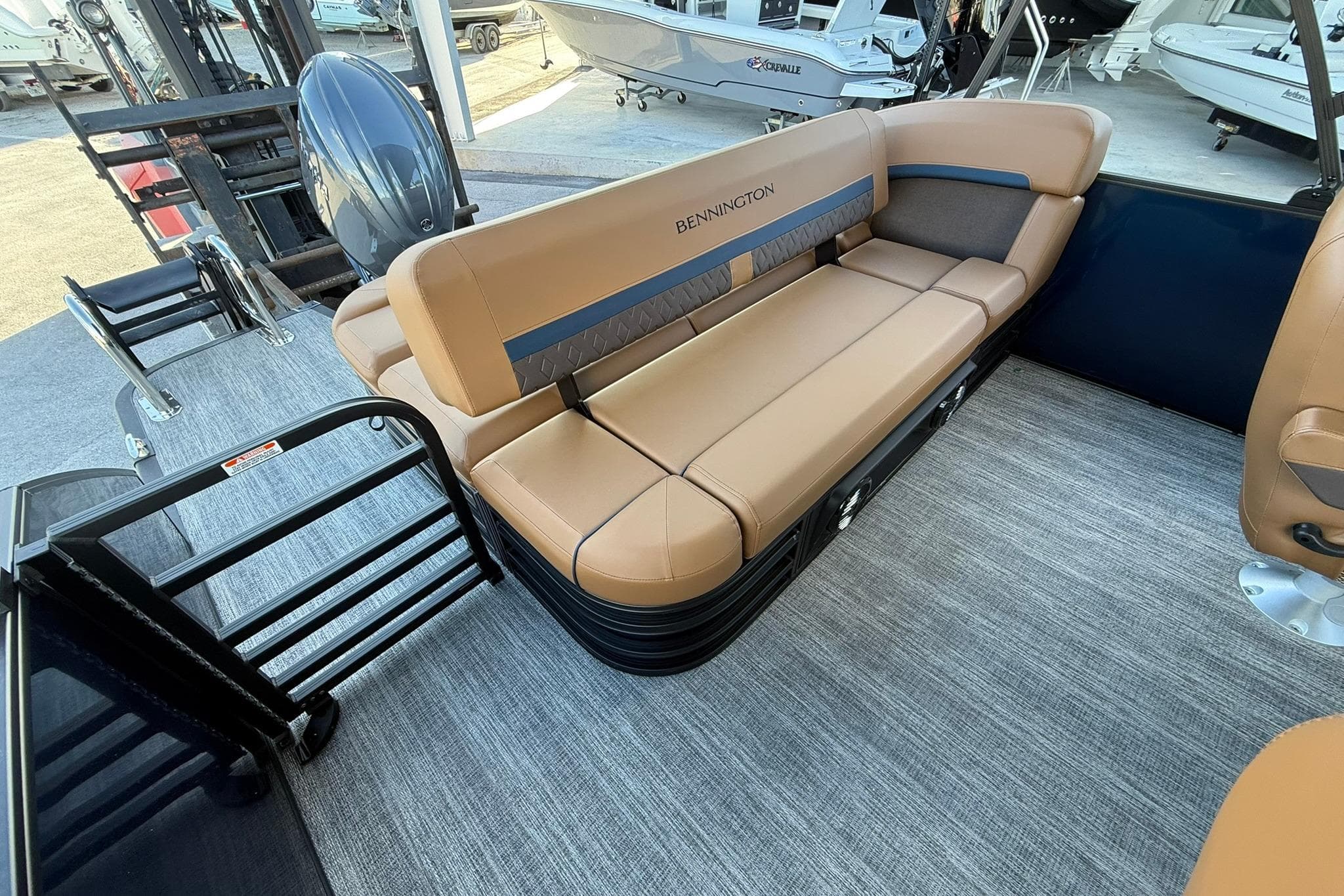 2026 Bennington 22 M Swingback boat interior with tan seating and modern design.