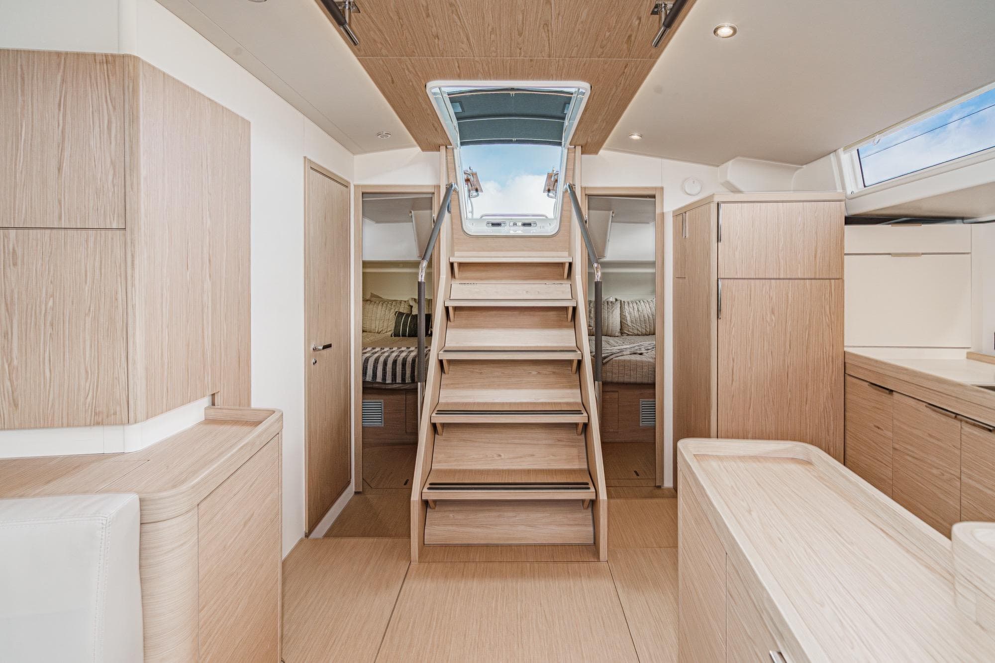Interior of 2022 Beneteau Oceanis Yacht 54, featuring modern wood finishes and spacious design.