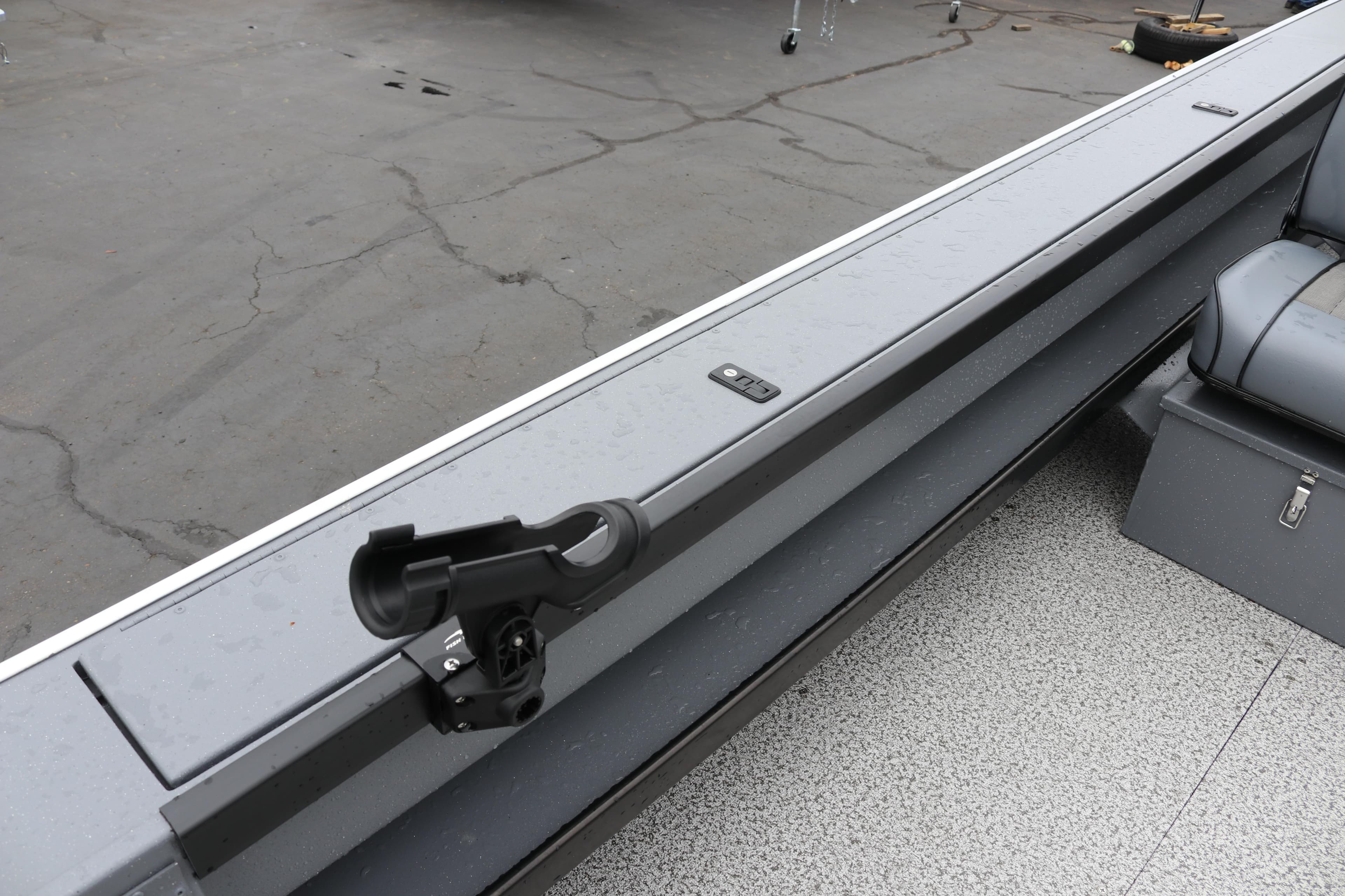 2026 Alumaweld Super Vee Pro 23 boat interior with rod holder and seating.