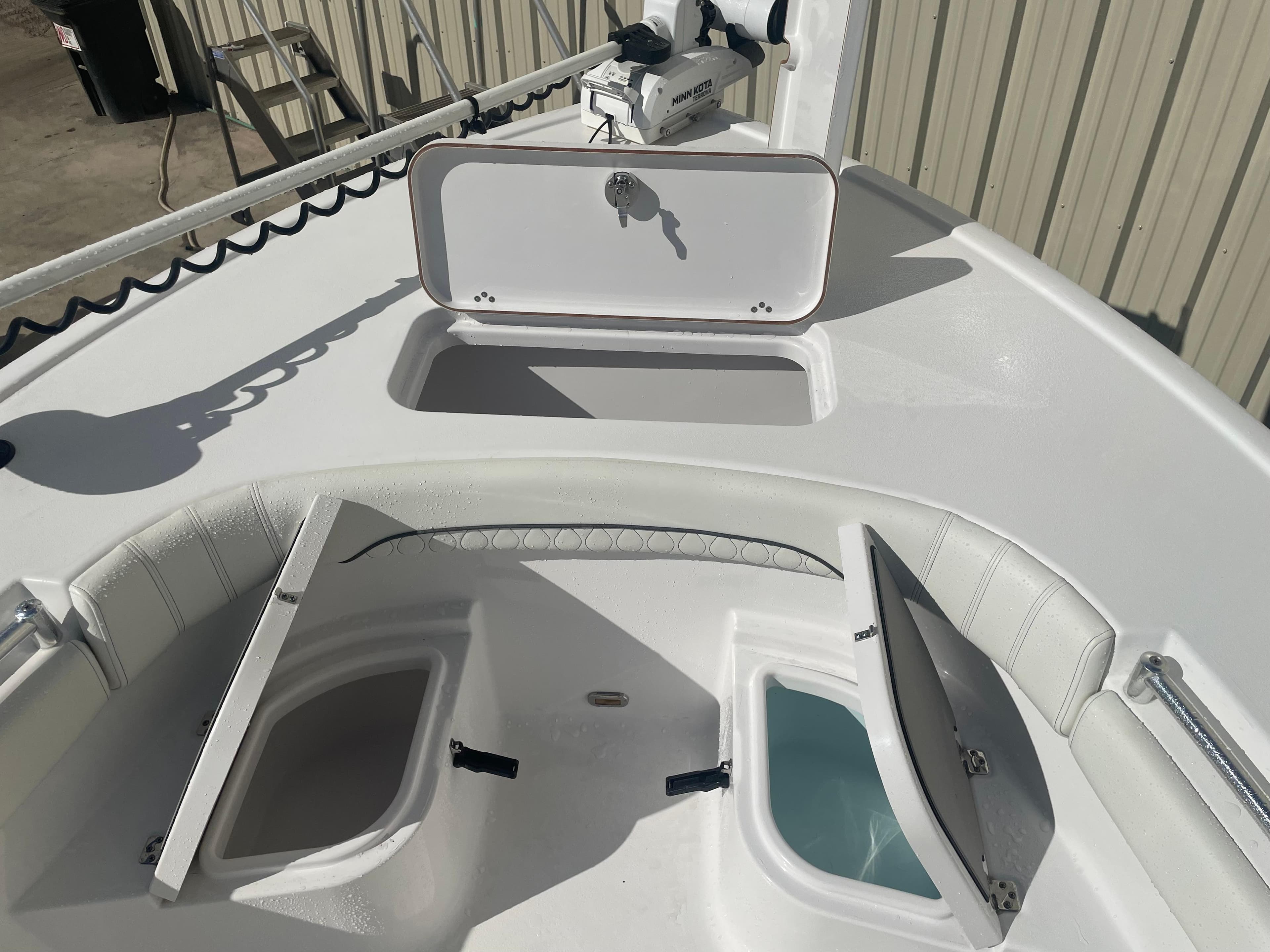 2020 Sportsman Masters 267OE Bay Boat with open storage compartments.