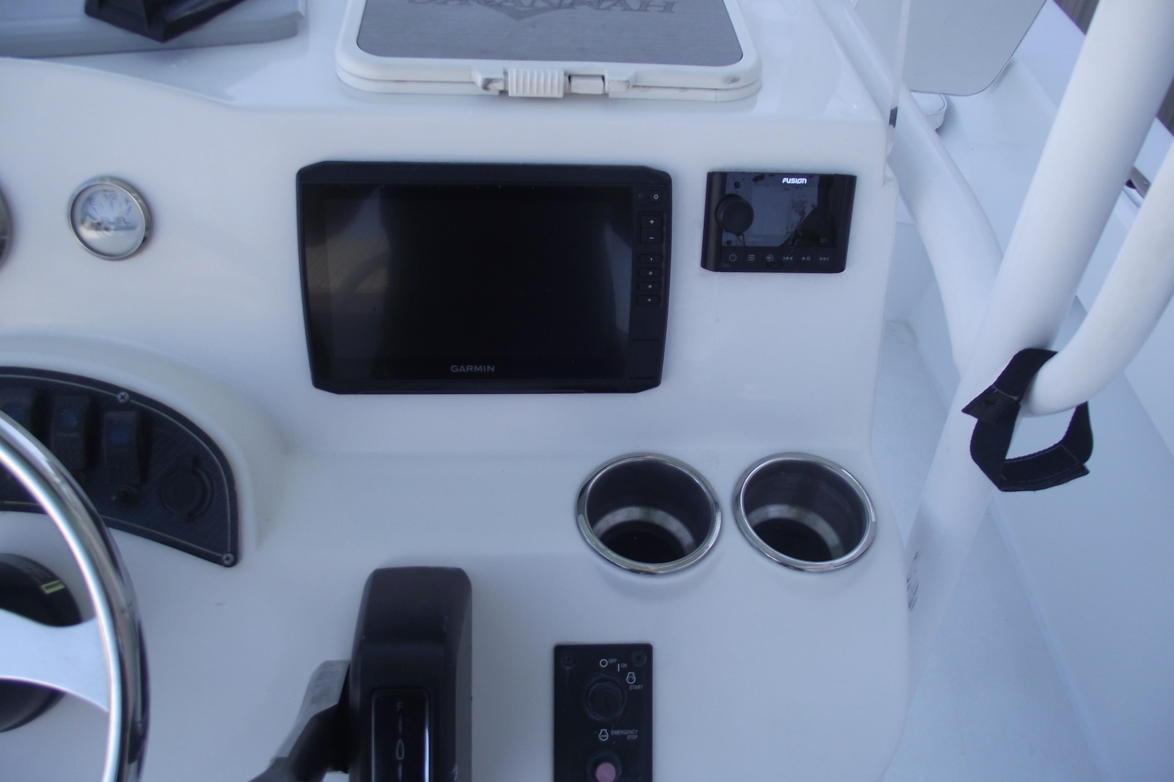 Control panel of 2021 Savannah SS21 boat with Garmin display and cup holders.