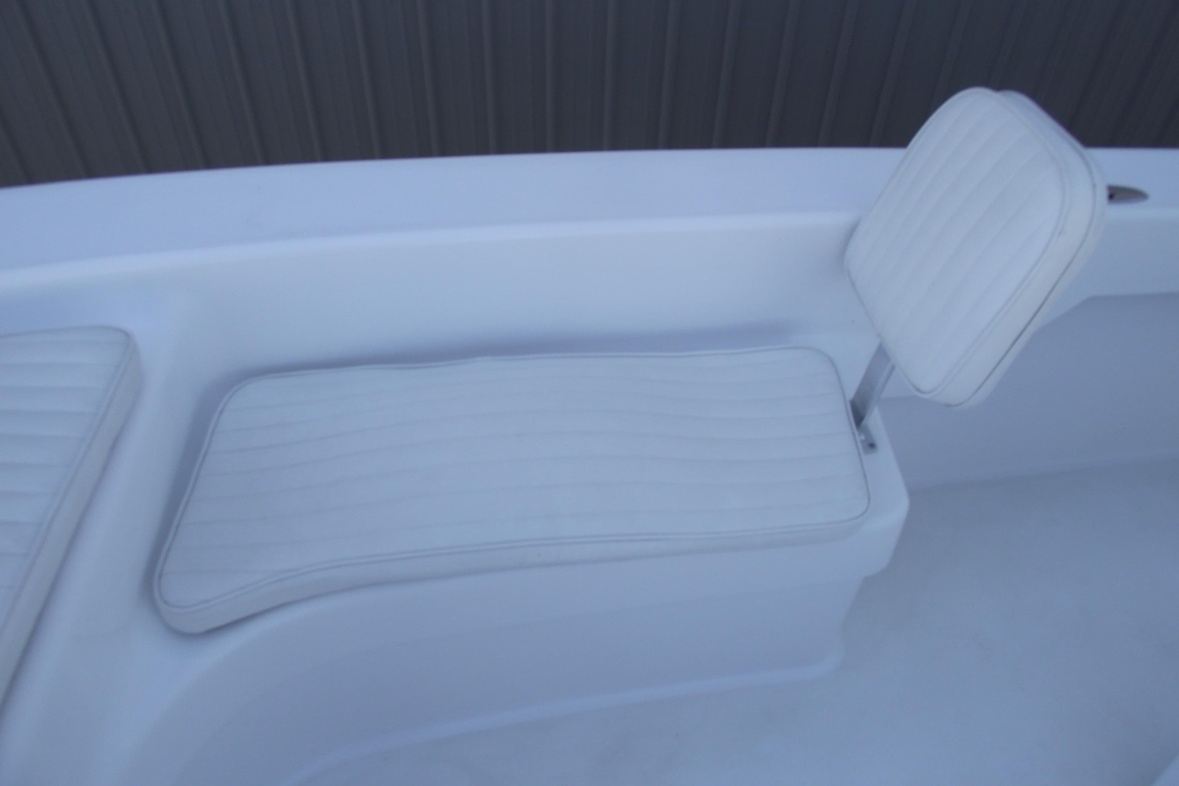 White cushioned seating on 2021 Savannah SS21 boat, featuring sleek design and comfort.