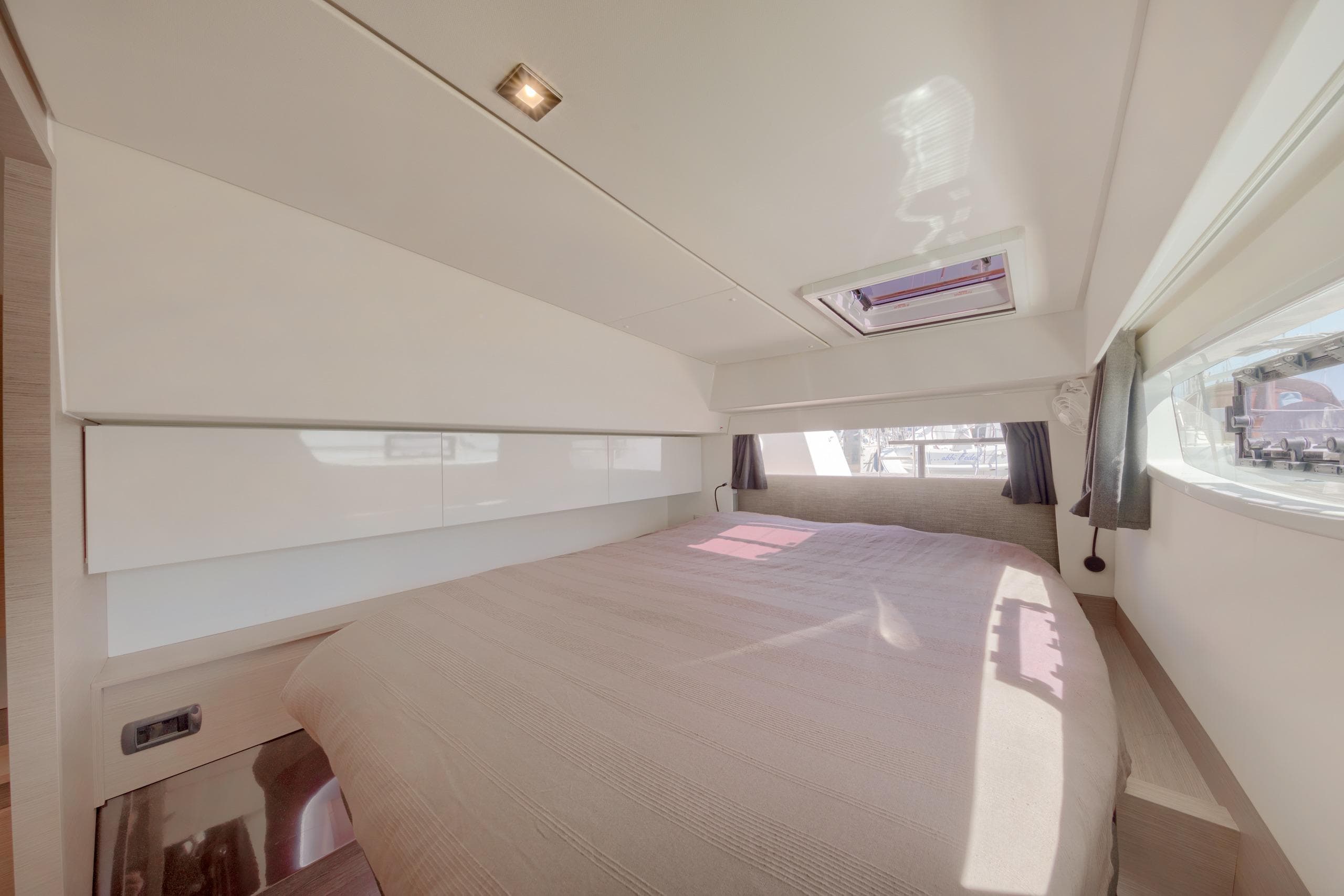 Luxurious bedroom interior of 2023 Fountaine Pajot Elba 45 Catamaran with modern design.
