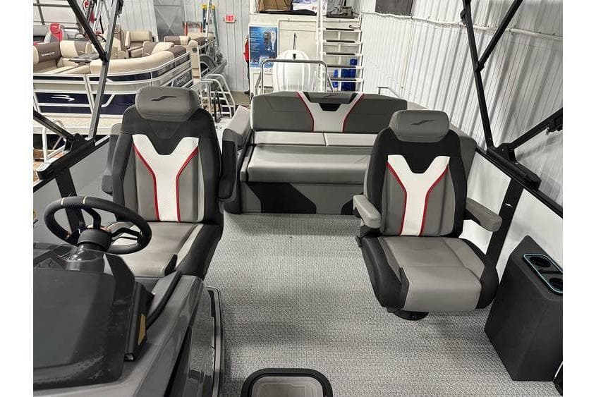 2026 Evotti 723CS boat interior with modern seating and steering wheel in showroom.
