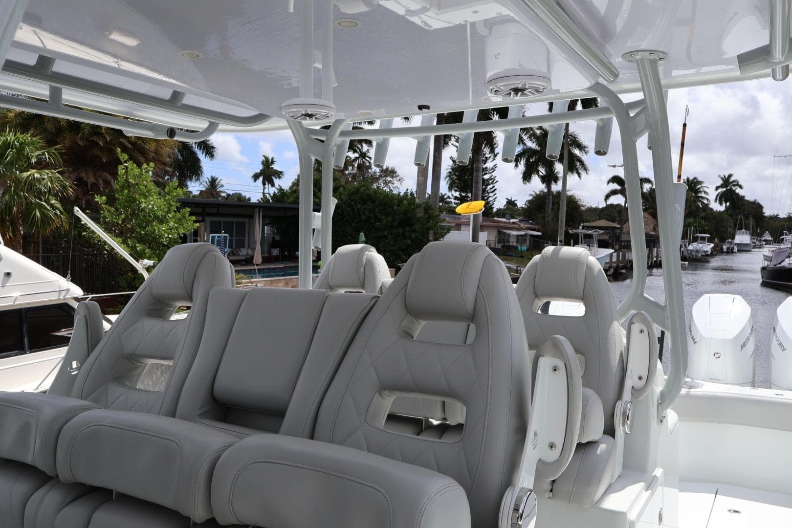 Luxury seating on a 2021 Freeman 42LR boat, featuring sleek design and waterfront view.