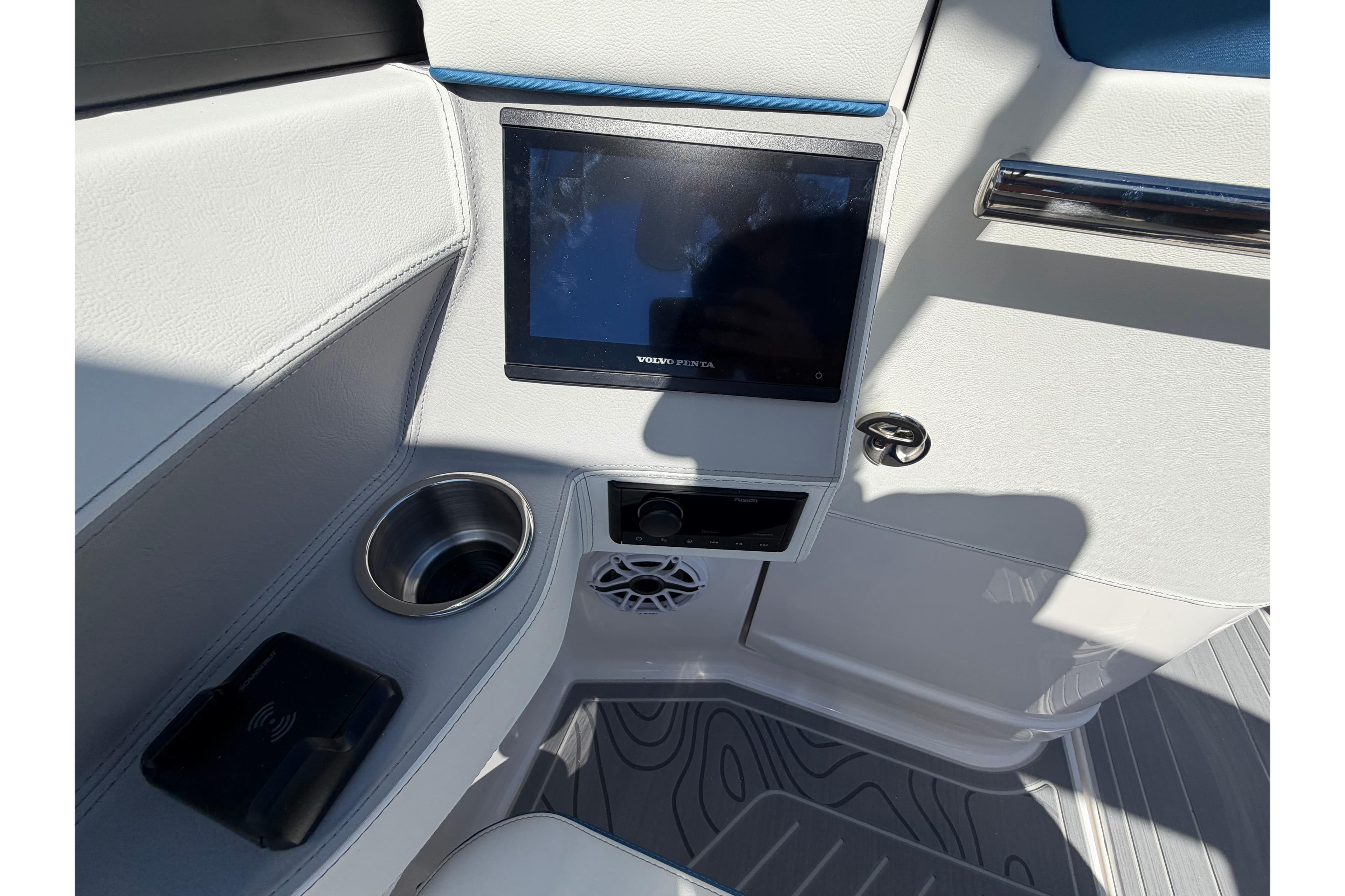 2026 Regal LS6 Surf boat interior with touchscreen, cup holder, and sleek design.