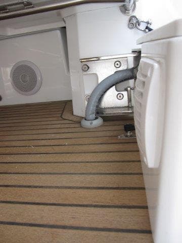 2024 Jeanneau 55 yacht interior detail showing teak flooring and equipment.