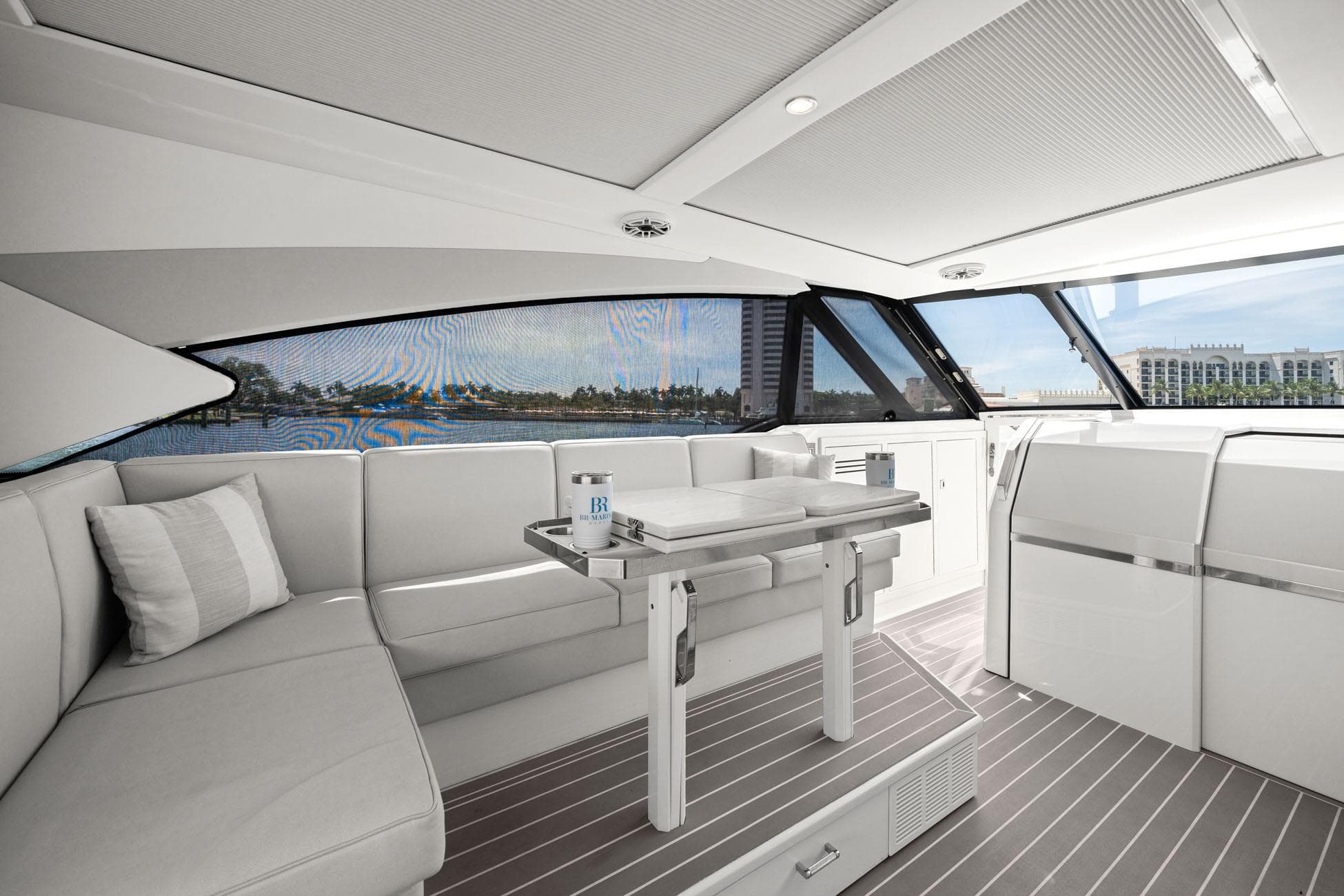 Luxurious interior of 2025 Formula 500 Super Sport Crossover yacht with sleek seating and table.
