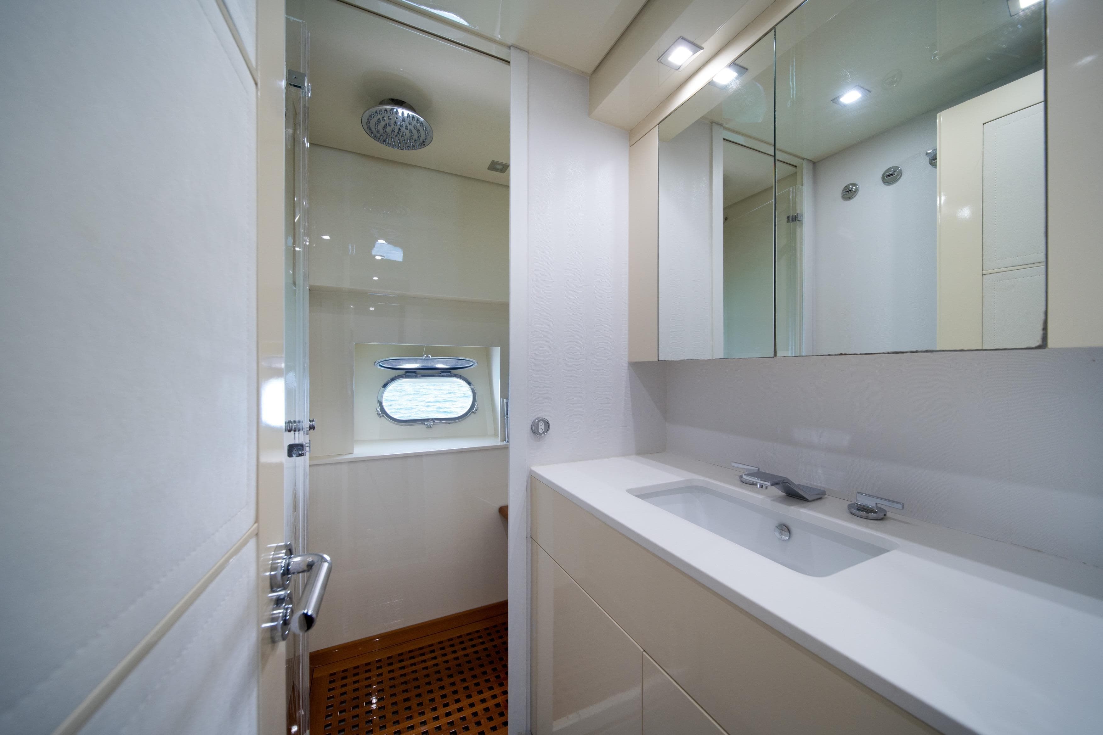 Luxurious bathroom interior on 2008 Arno Leopard 31 yacht, featuring modern fixtures and elegant design.