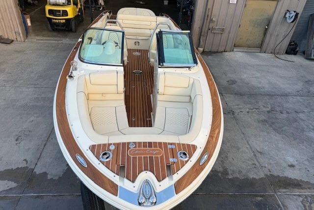 2022 Chris-Craft Launch 25 GT boat with elegant wood detailing and spacious seating.