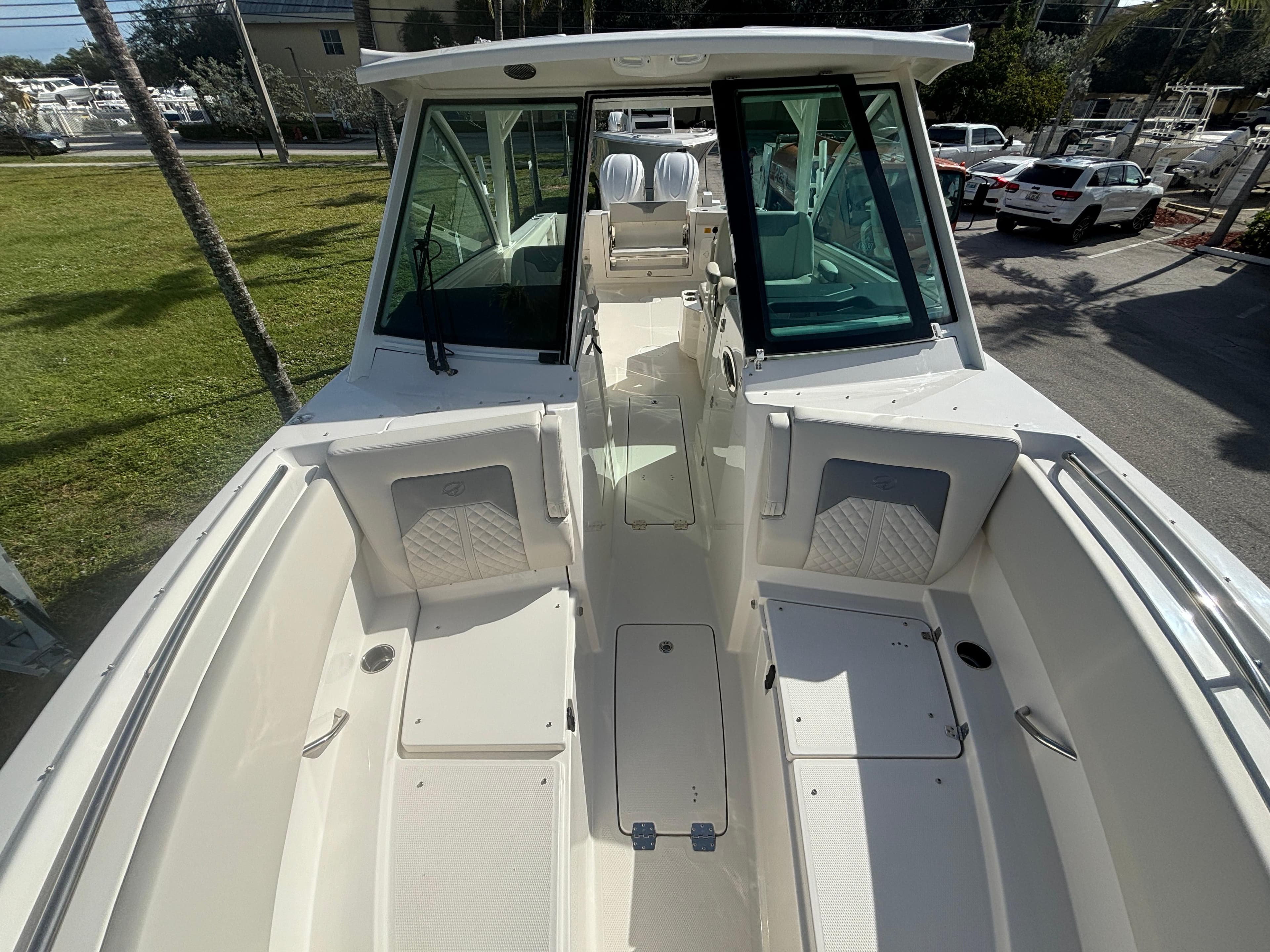2025 Sailfish 316 DC boat interior with seating and storage compartments.