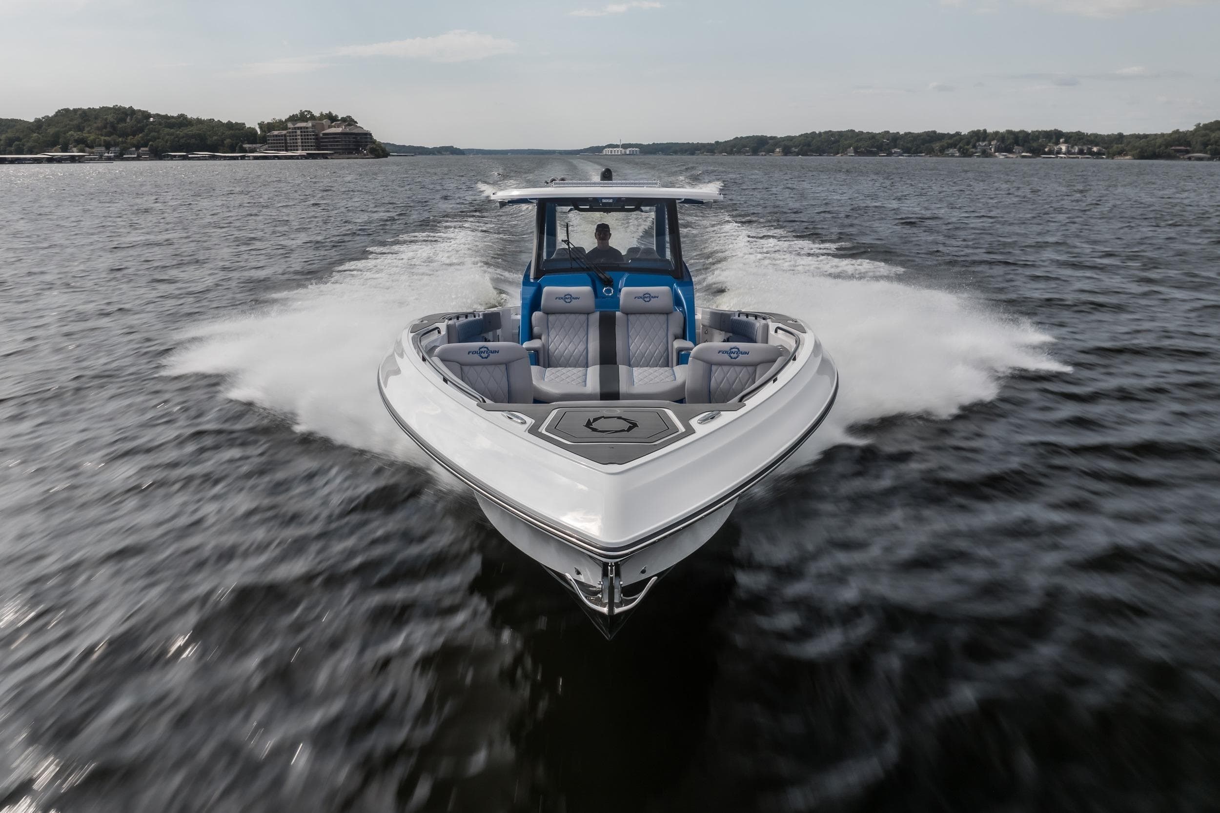 2026 Fountain 43 SCX speedboat cruising on open water, showcasing sleek design and performance.