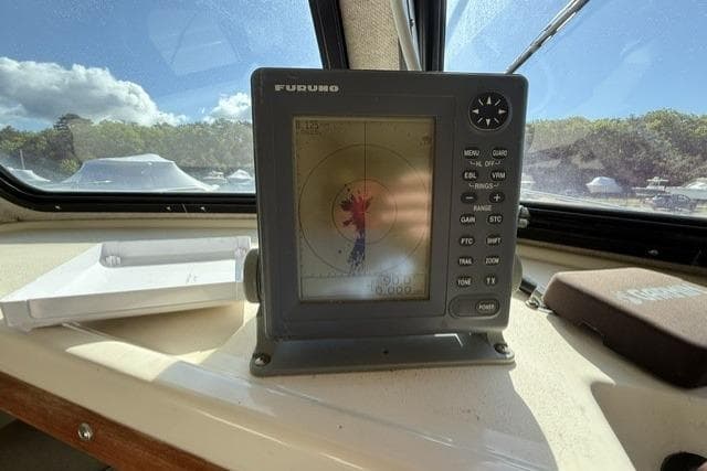 Furuno radar display inside 2001 Parker 2520 Deep Vee Sport Cabin boat cockpit.