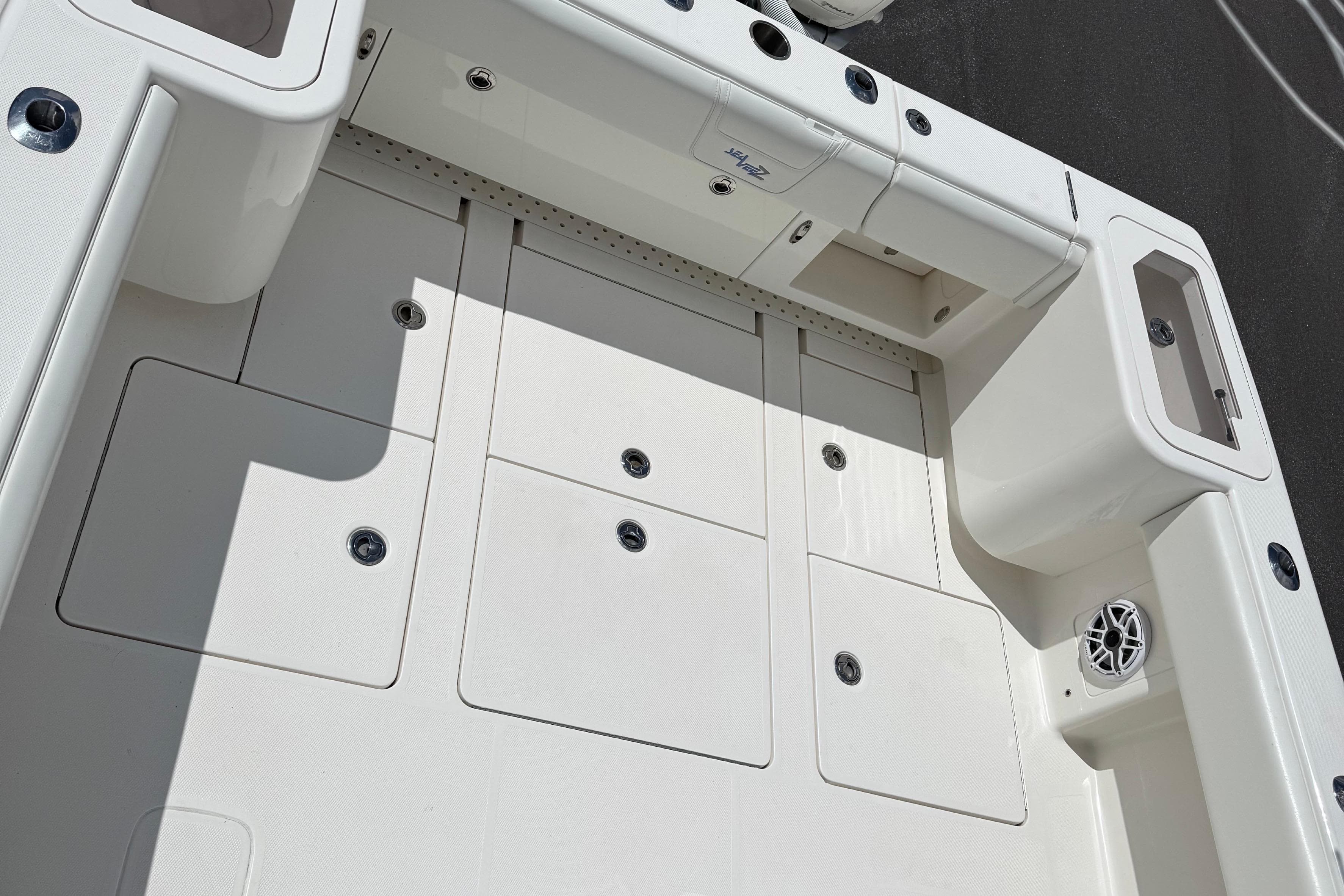 2024 SeaVee 32Z boat deck with storage compartments and speaker.