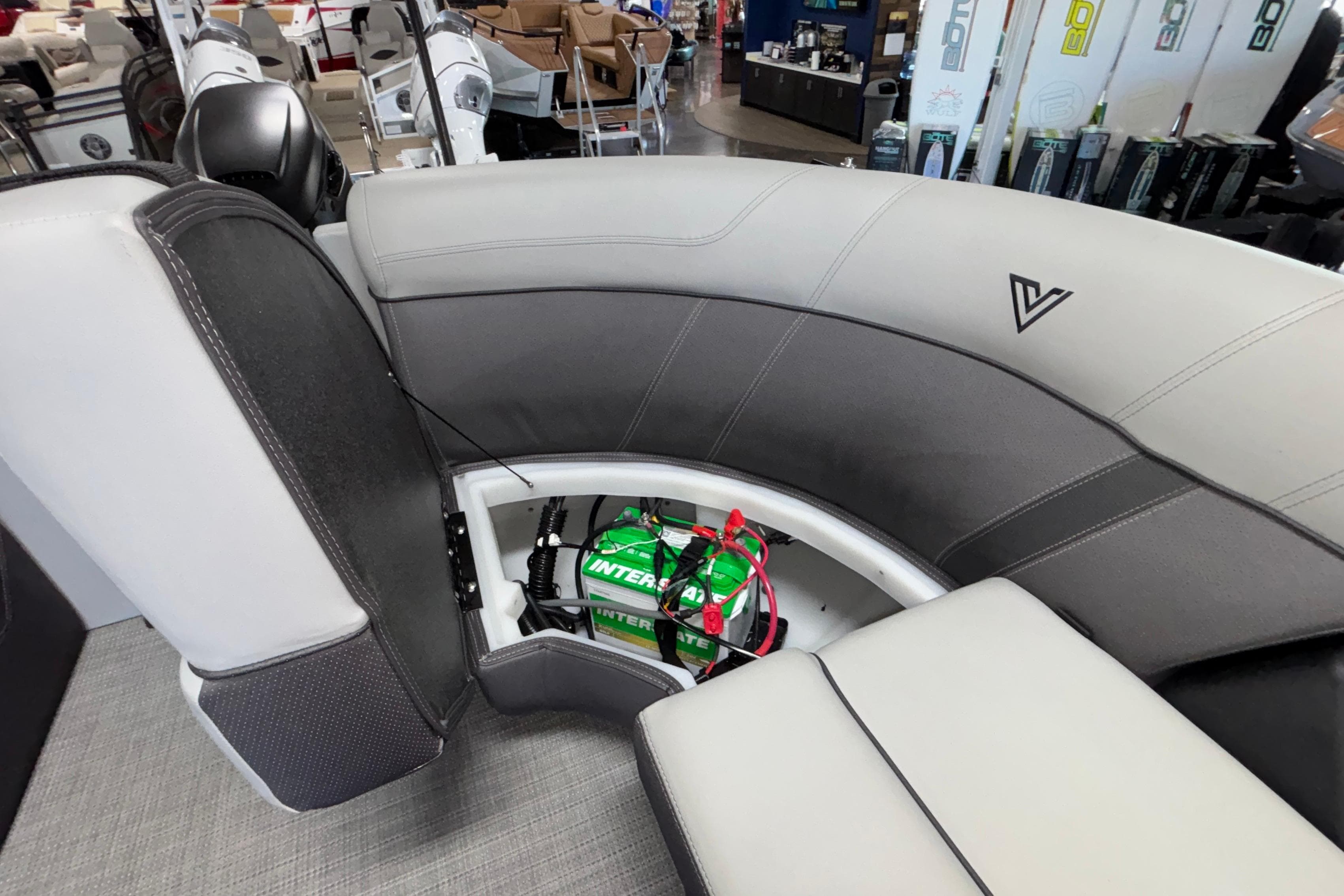 Interior of 2026 Viaggio Z24U boat with storage compartment and battery.