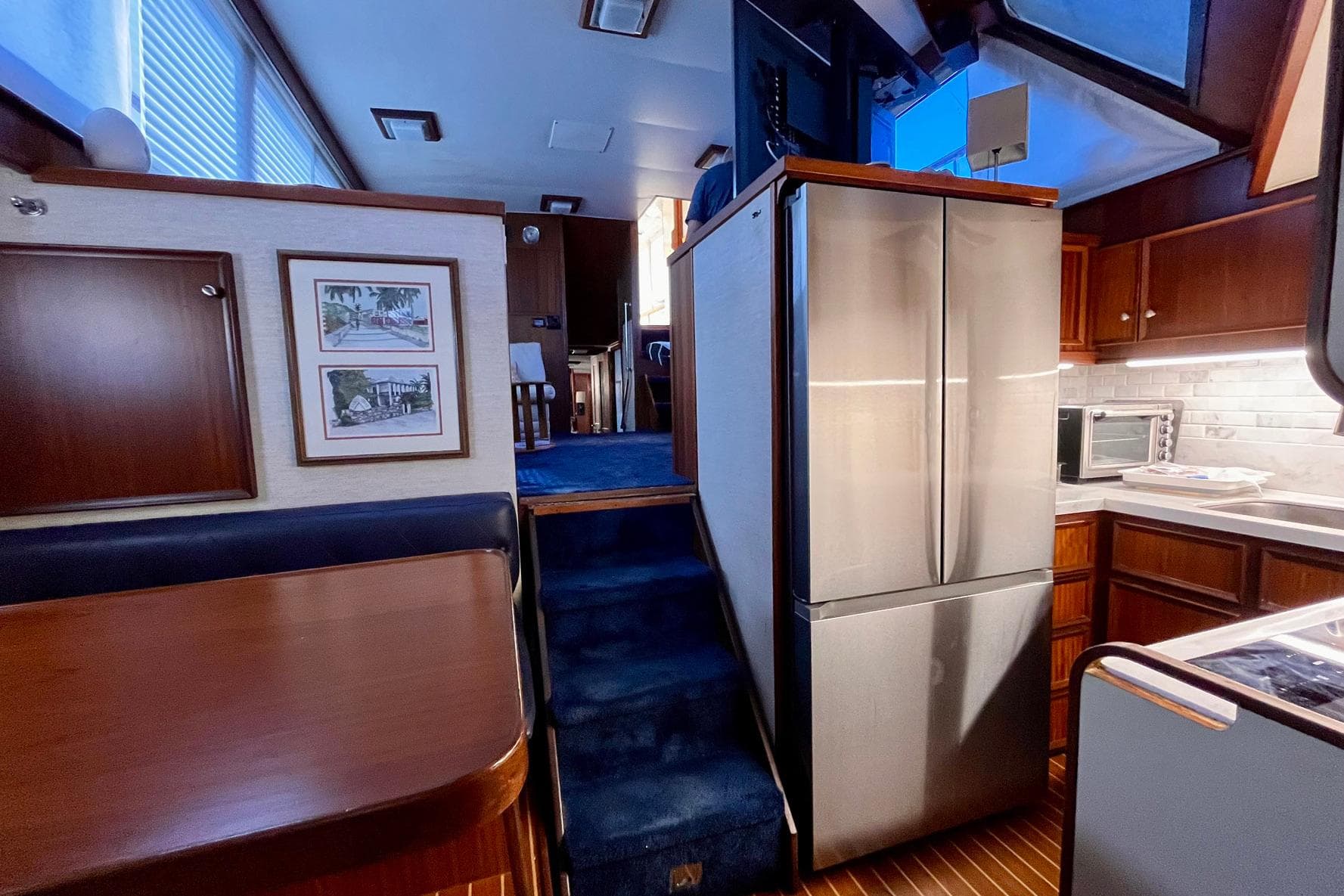 Interior of 1981 Hatteras 48 Motor Yacht with modern kitchen and dining area.