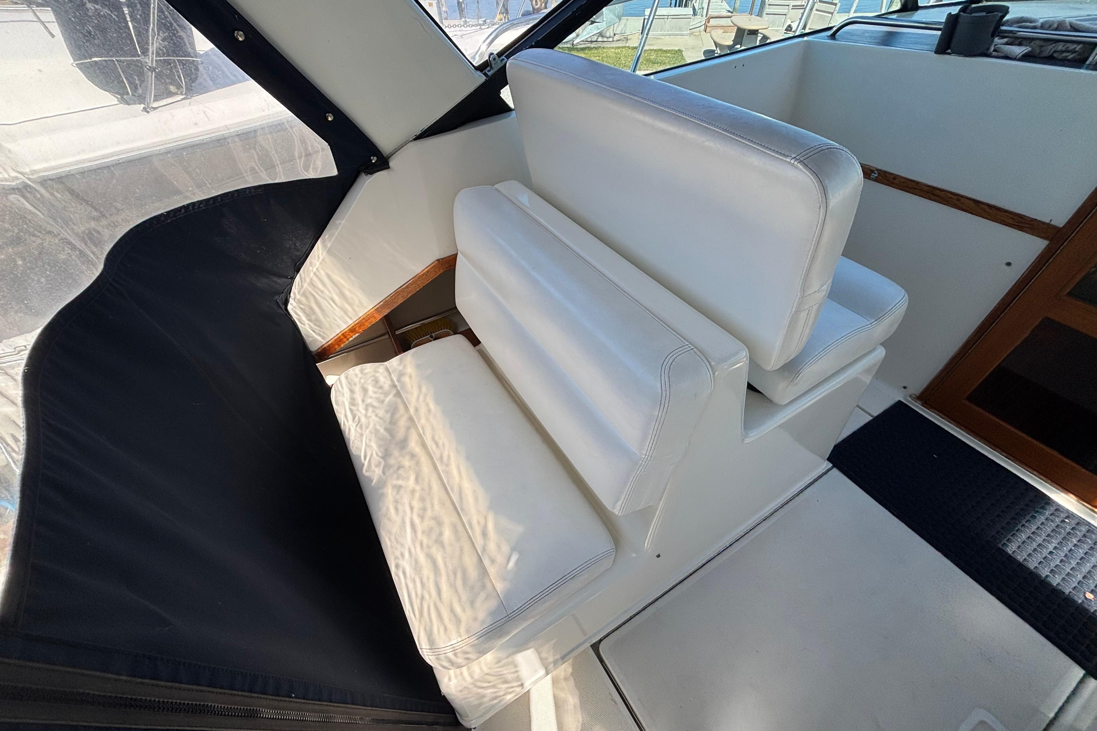 White seating area on a 1991 Tiara Yachts 3100 Open boat.