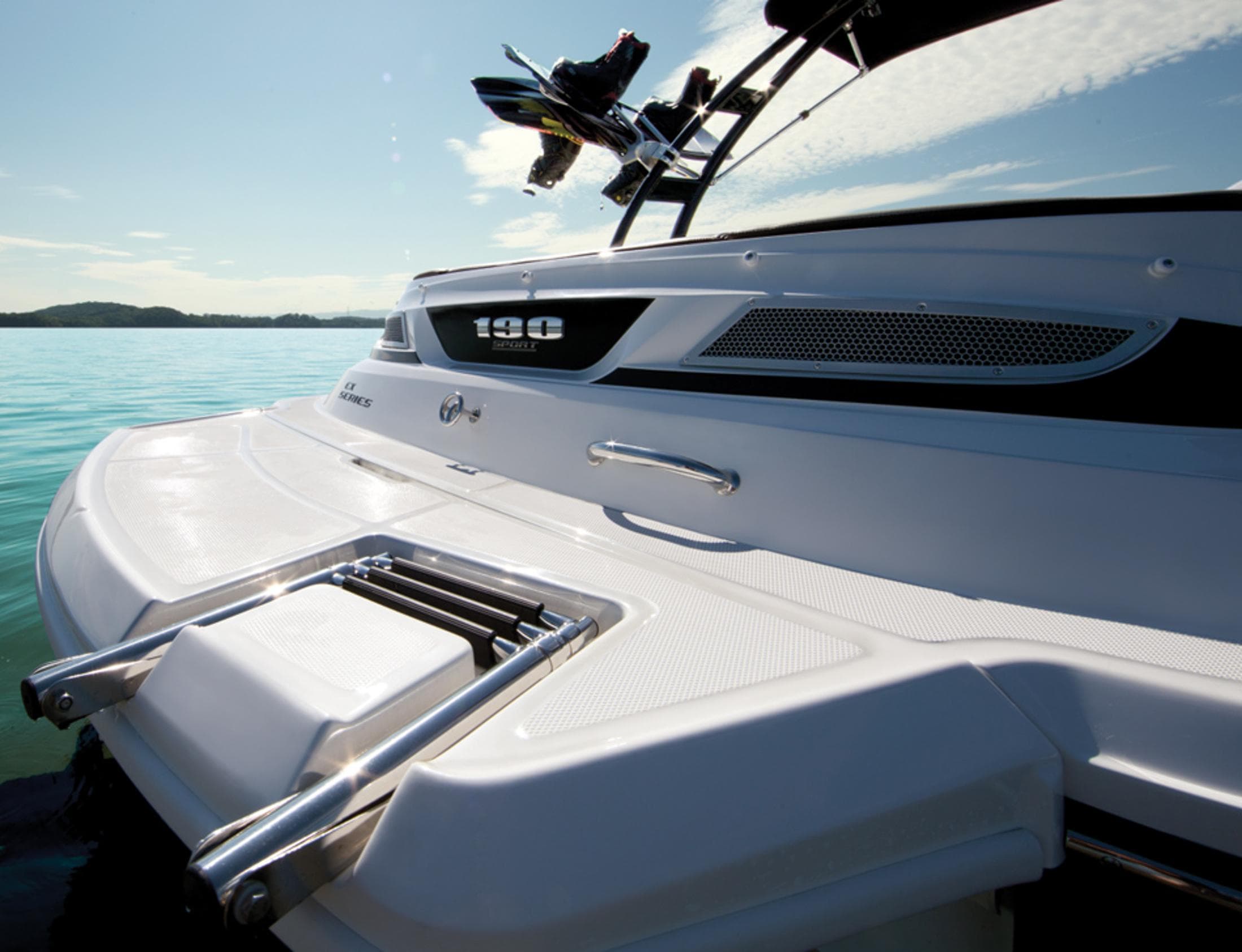 Manufacturer Provided Image: 2013 Sea Ray 190 Sport boat on a sunny lake.