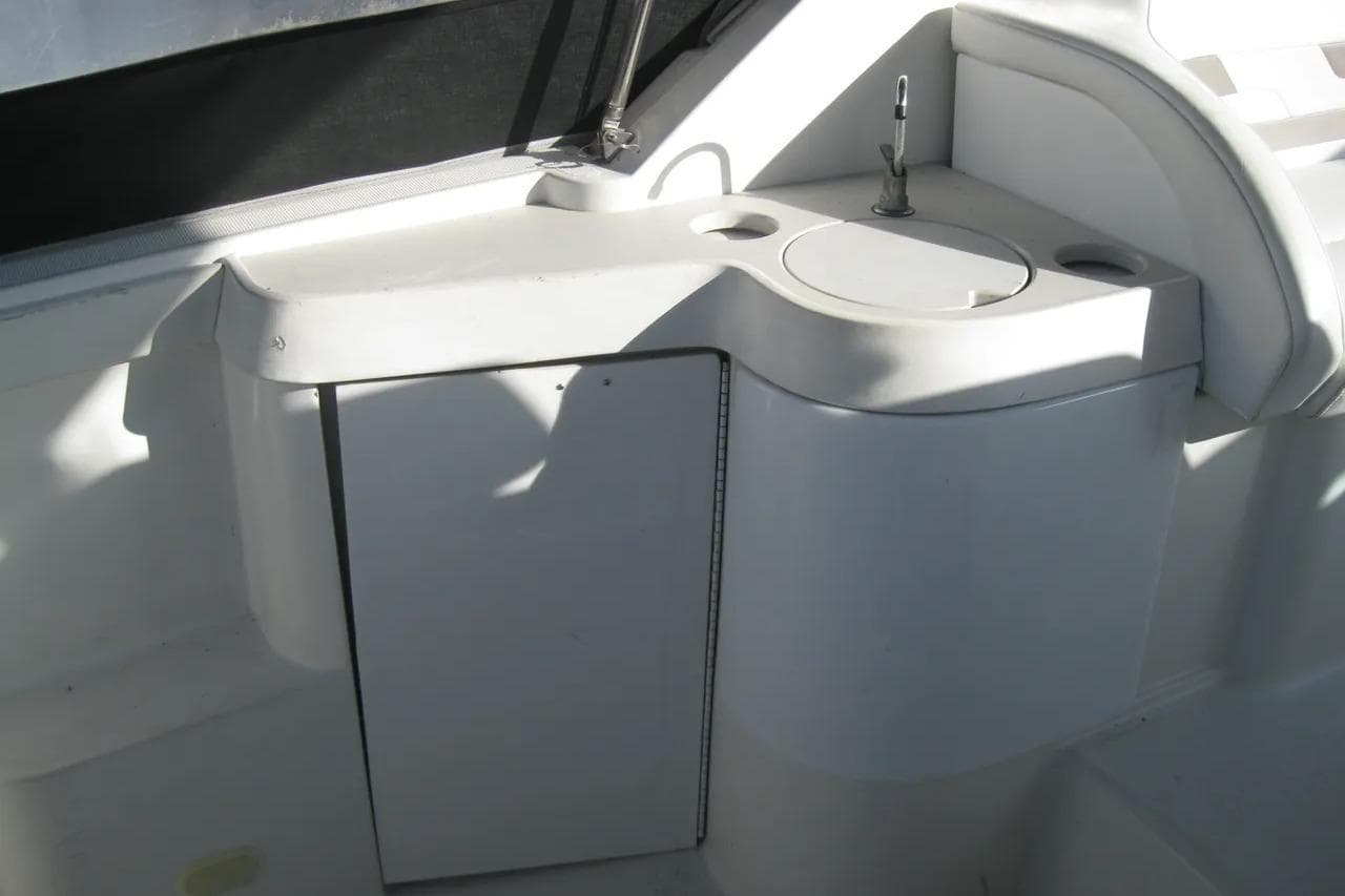 2000 Formula 31 Performance Cruiser interior with compact sink and storage area.