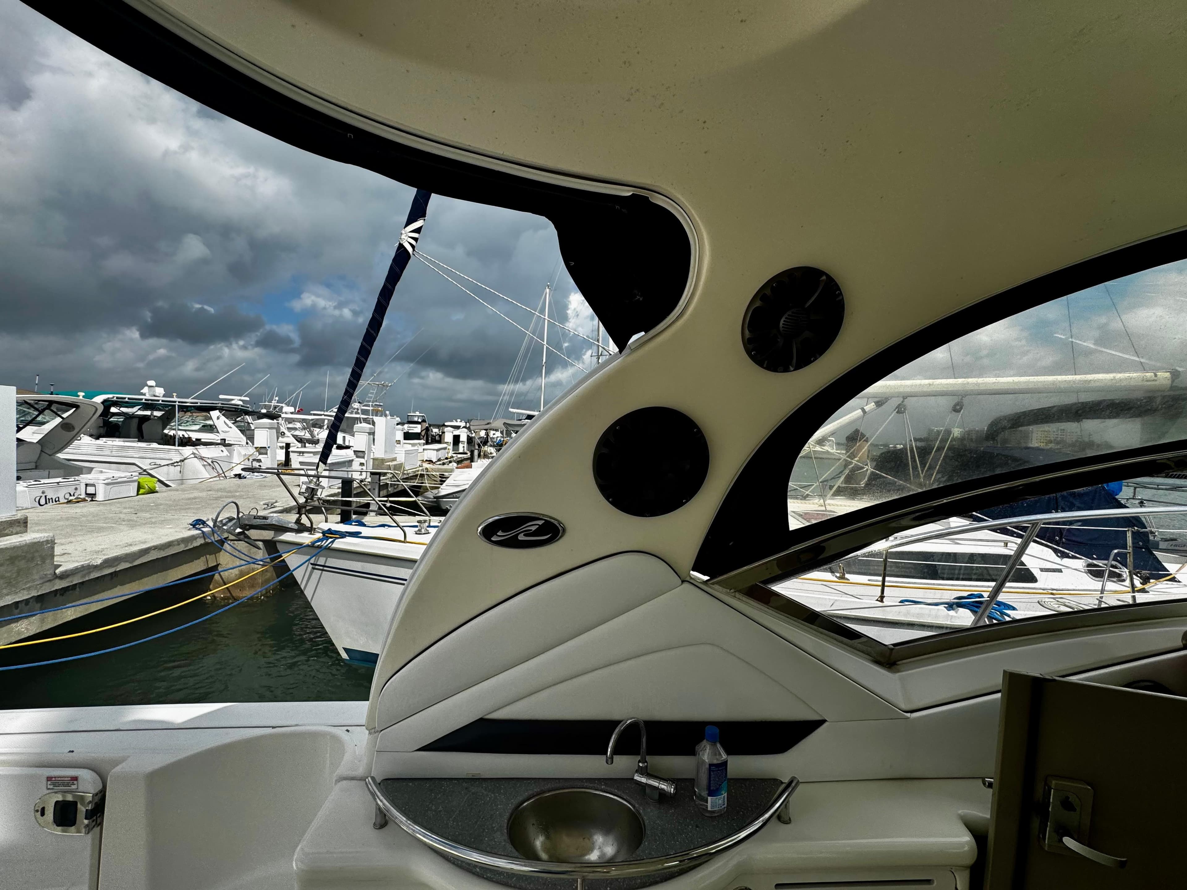 2007 Sea Ray 40 Sundancer interior view at marina, showcasing sleek design and amenities.