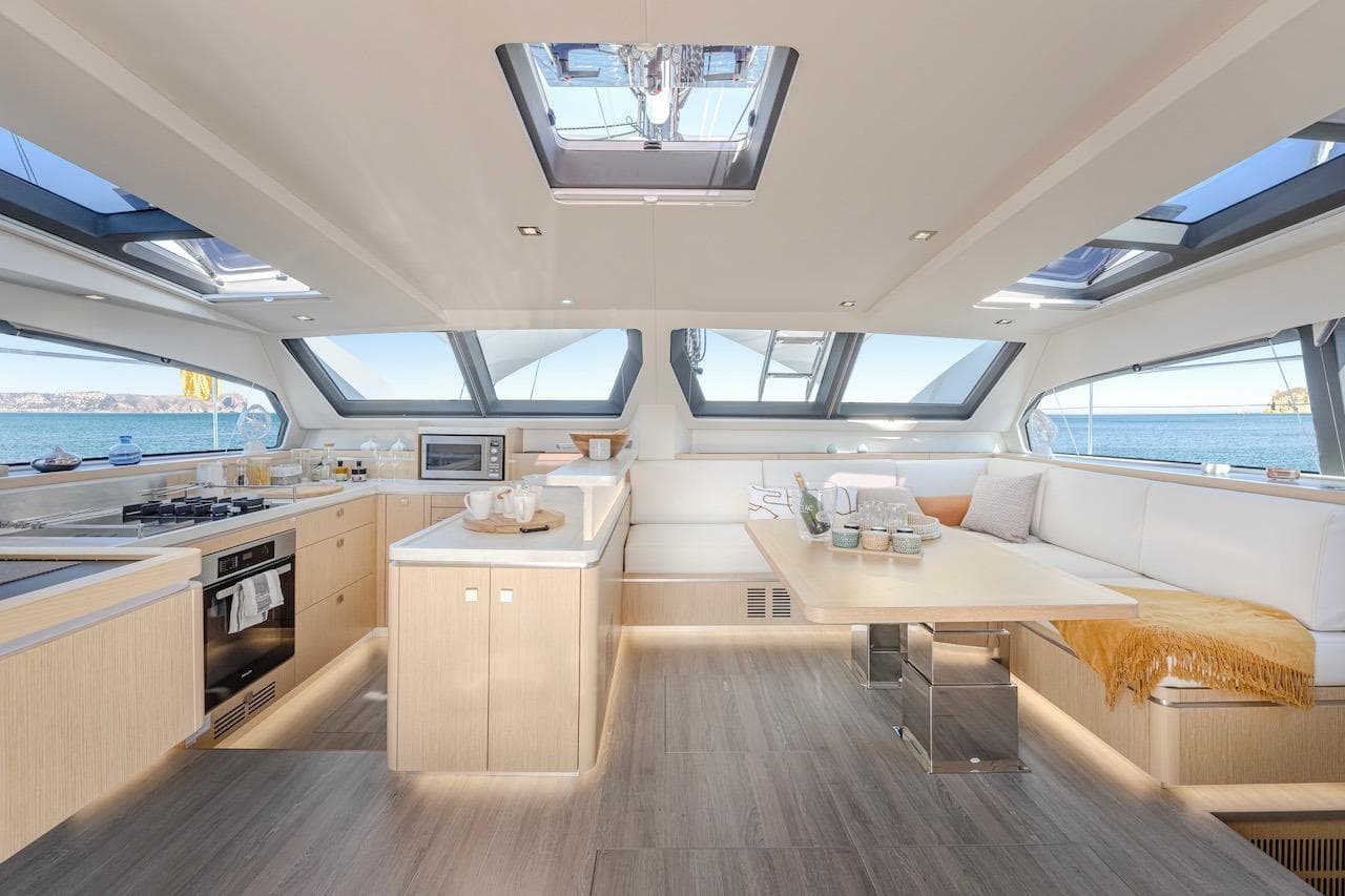 Interior of Privilege Signature 510 yacht, 2025 model, featuring modern kitchen and dining area.