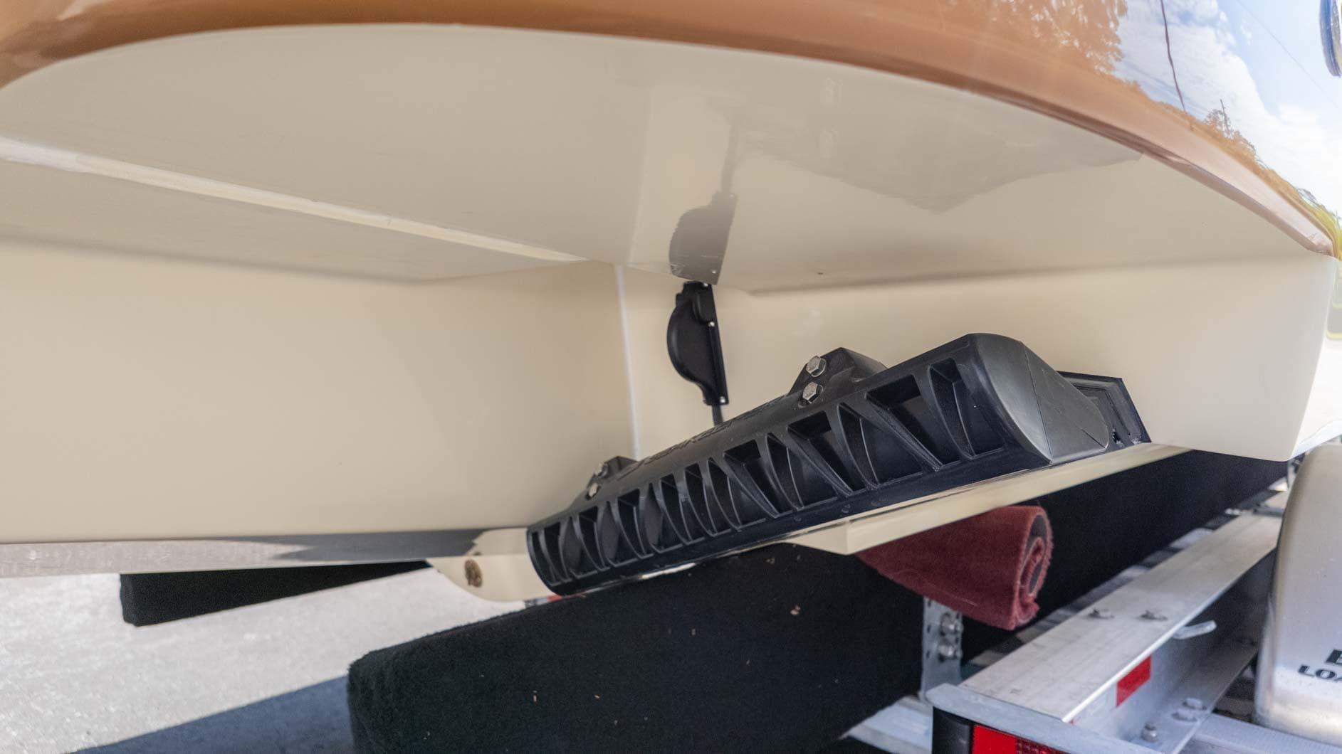 2025 Chris-Craft Launch 28 GT boat hull and trim tab detail.