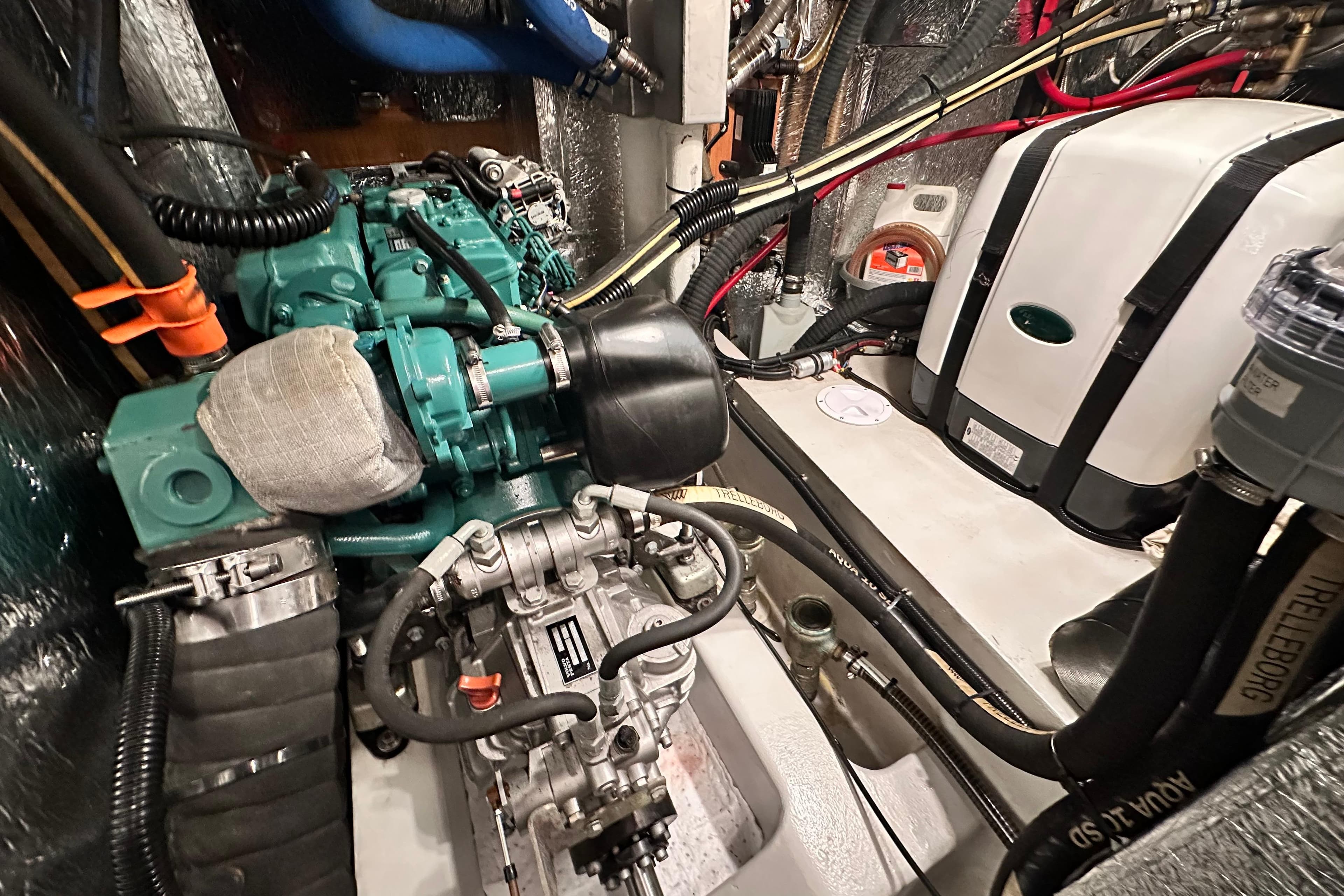 Engine room of 2019 Hallberg-Rassy 44 yacht, showcasing mechanical components and systems.