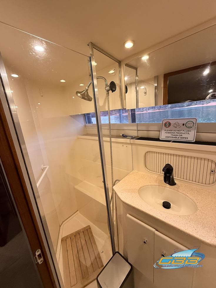 1998 Carver 405 Aft Cabin bathroom with shower and sink.