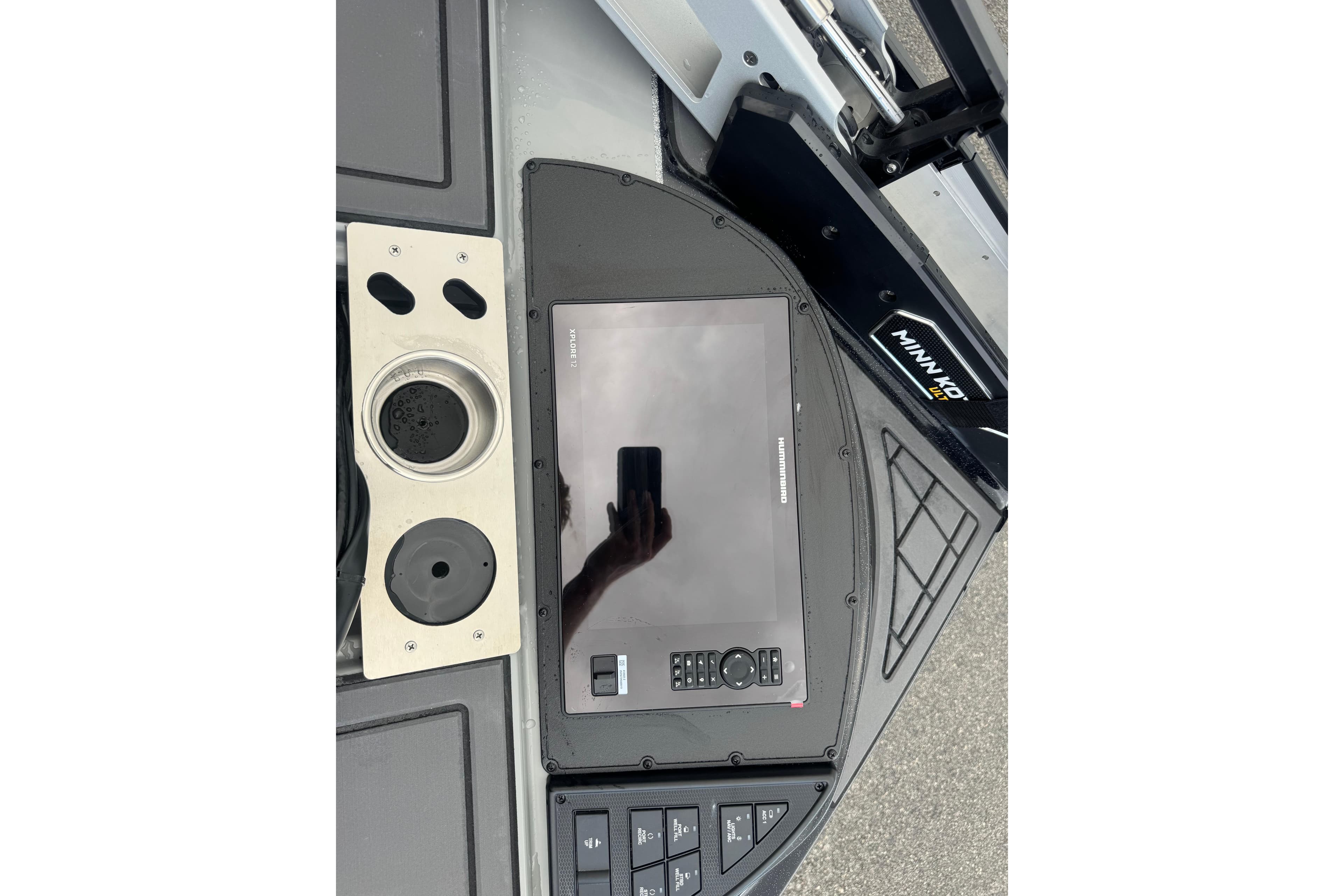 Control panel of 2026 Caymas XS 20 Pro boat with touchscreen and cup holder.