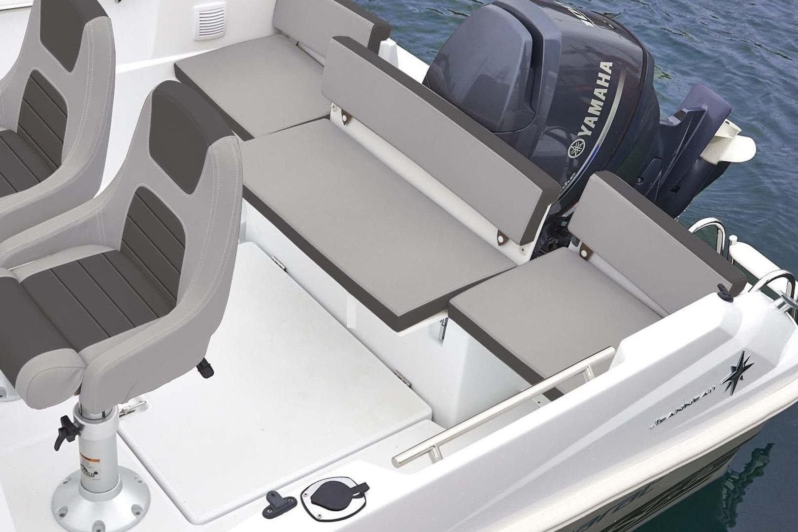 2026 Jeanneau Cap Camarat 6.5 WA boat interior with Yamaha engine and cushioned seating.