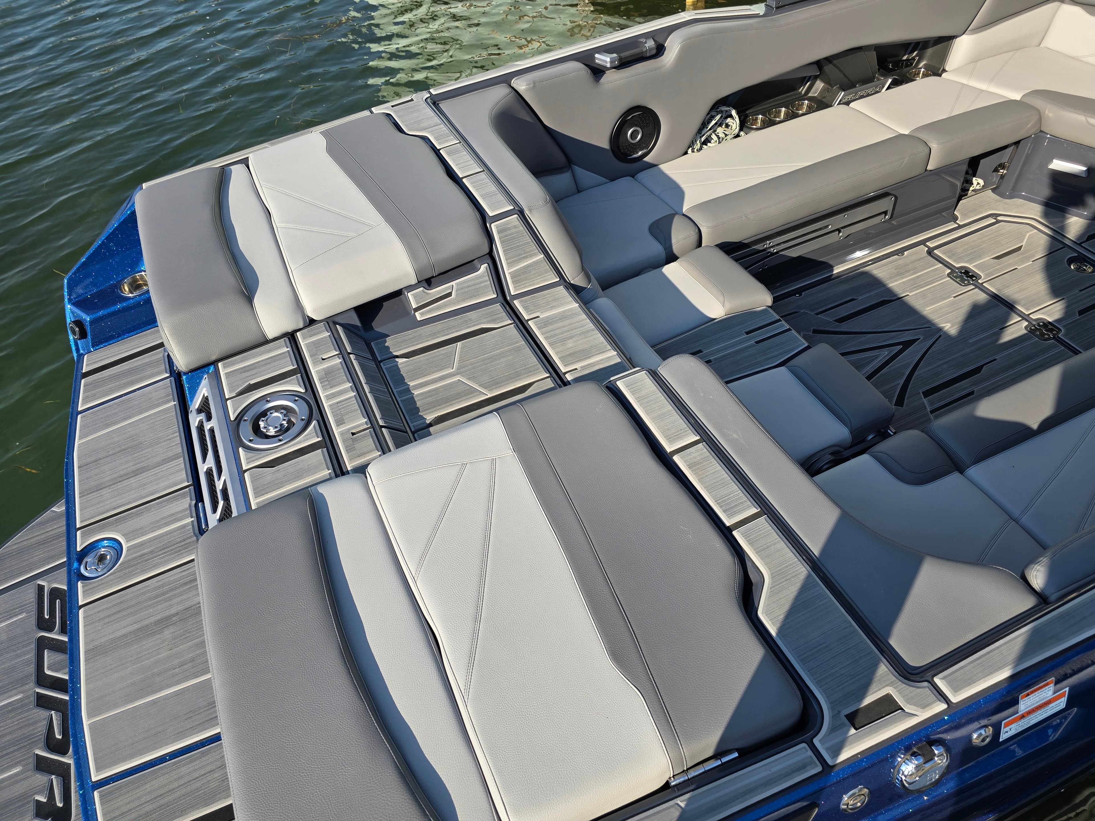 2024 Supra SL boat interior with sleek gray seating and modern design on the water.