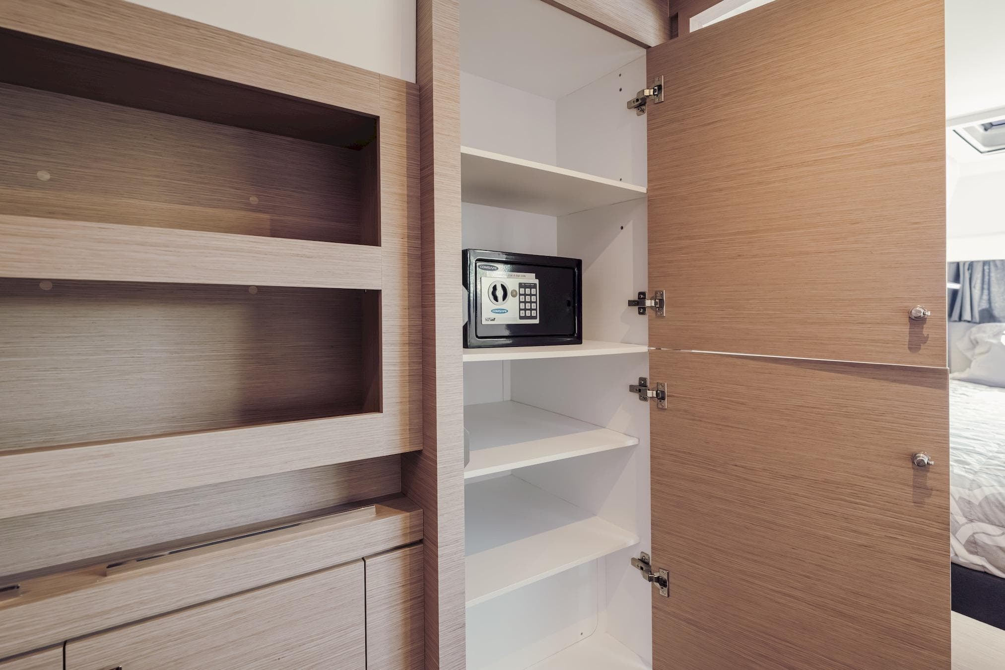 Interior of 2020 Fountaine Pajot Saona 47 yacht with open cabinet and safe.