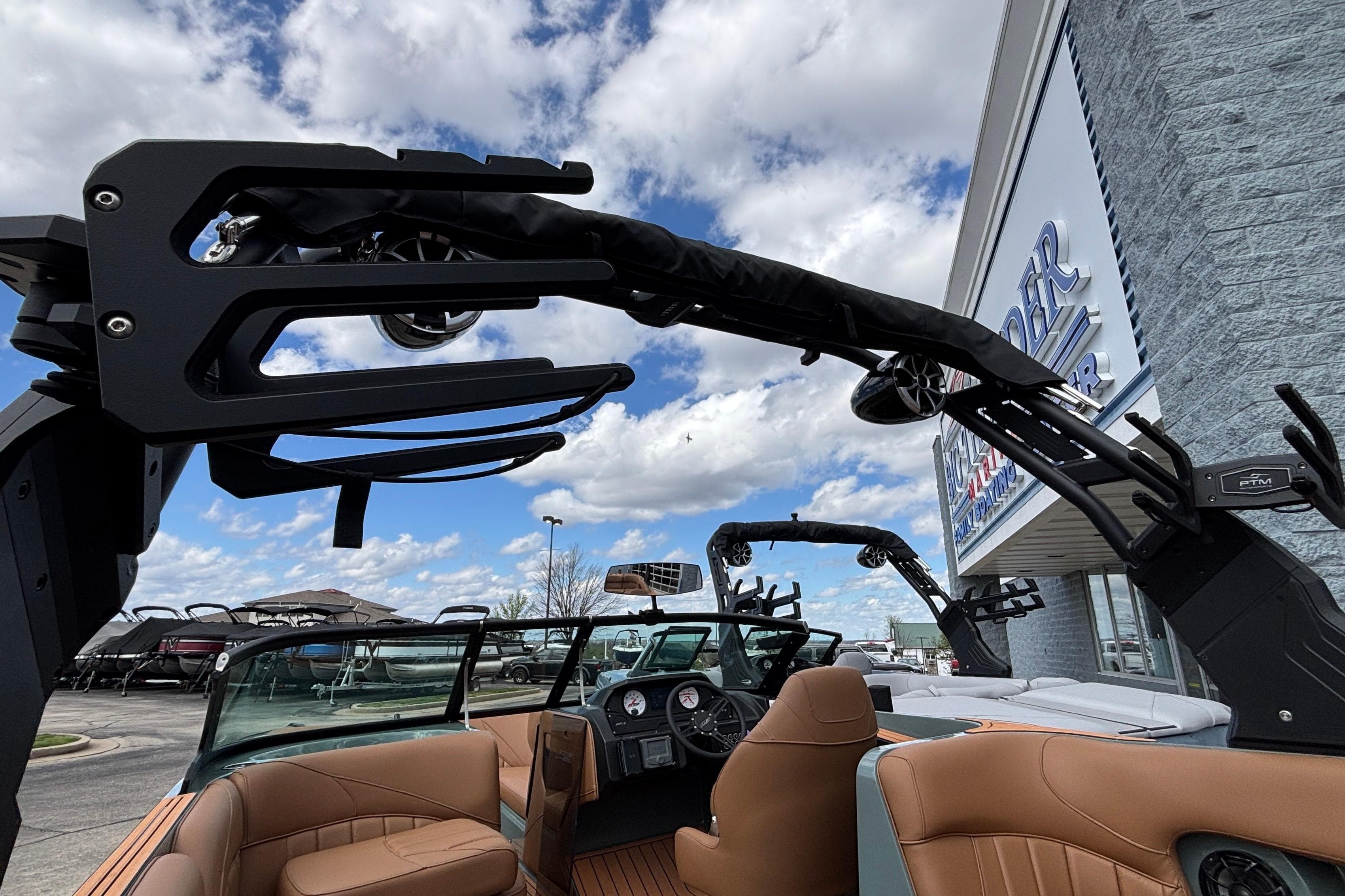 2026 MB B52 23 Classic boat with sleek design and luxurious interior at dealership.