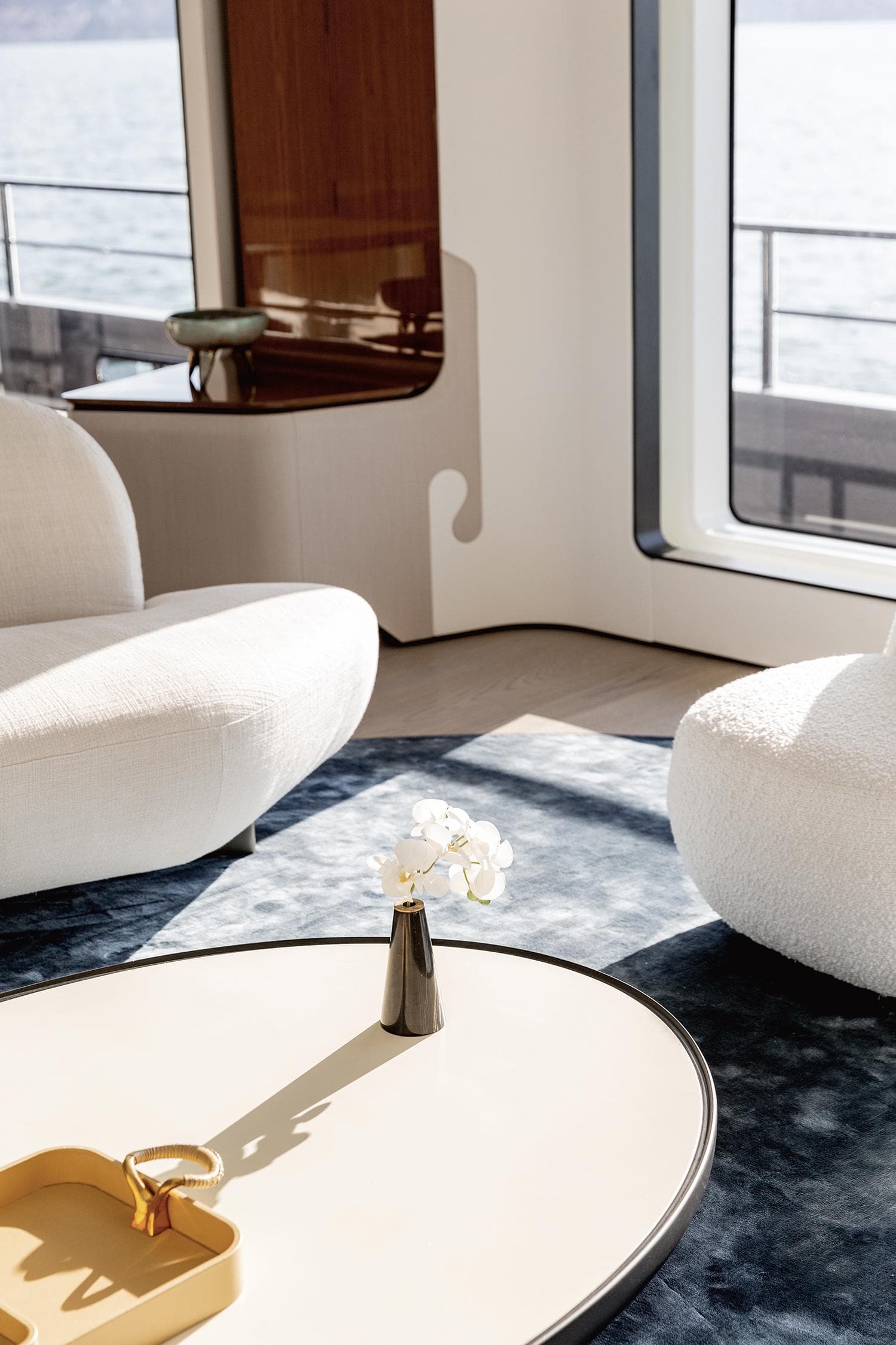 Luxurious interior of 2024 Azimut Grande 36M yacht with elegant seating and sea view.