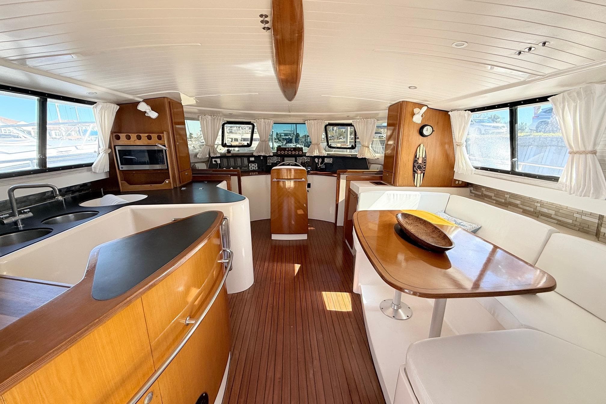 Spacious interior of 1999 Fountaine Pajot Maryland 37 yacht with elegant wood finishes.