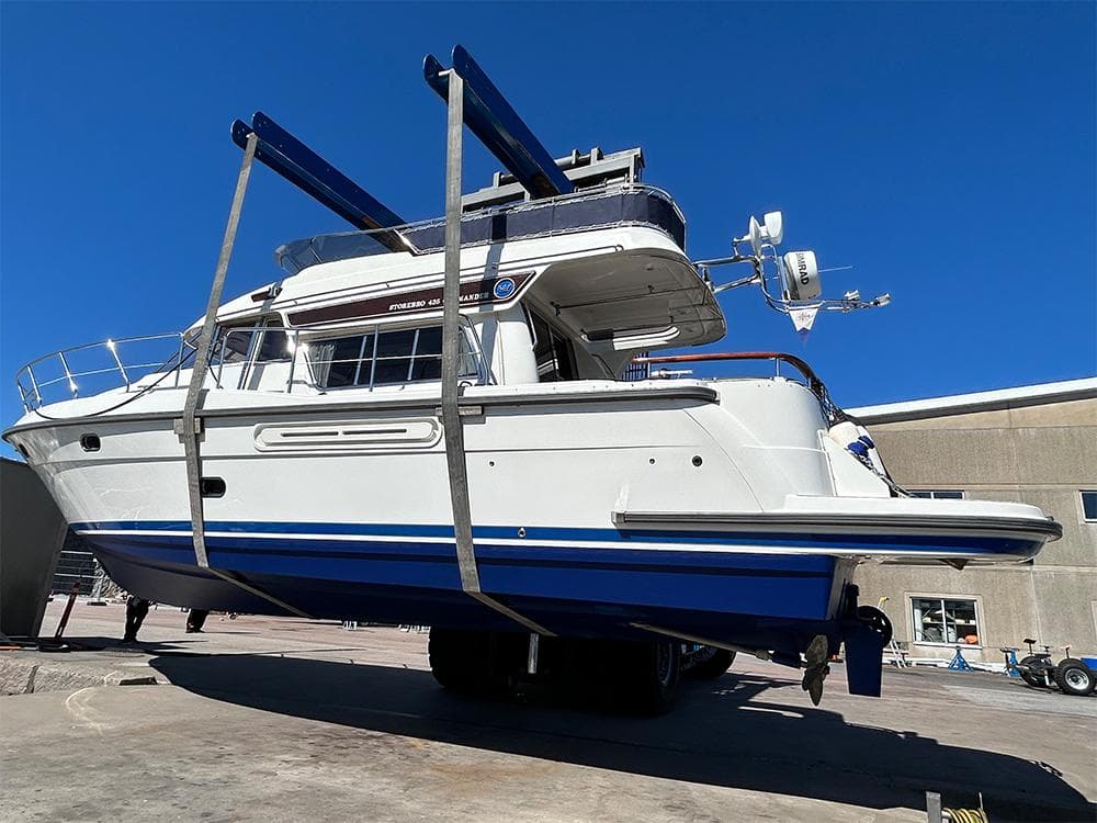 2014 Storebro 435 Commander yacht in dry dock, side view under clear blue sky.