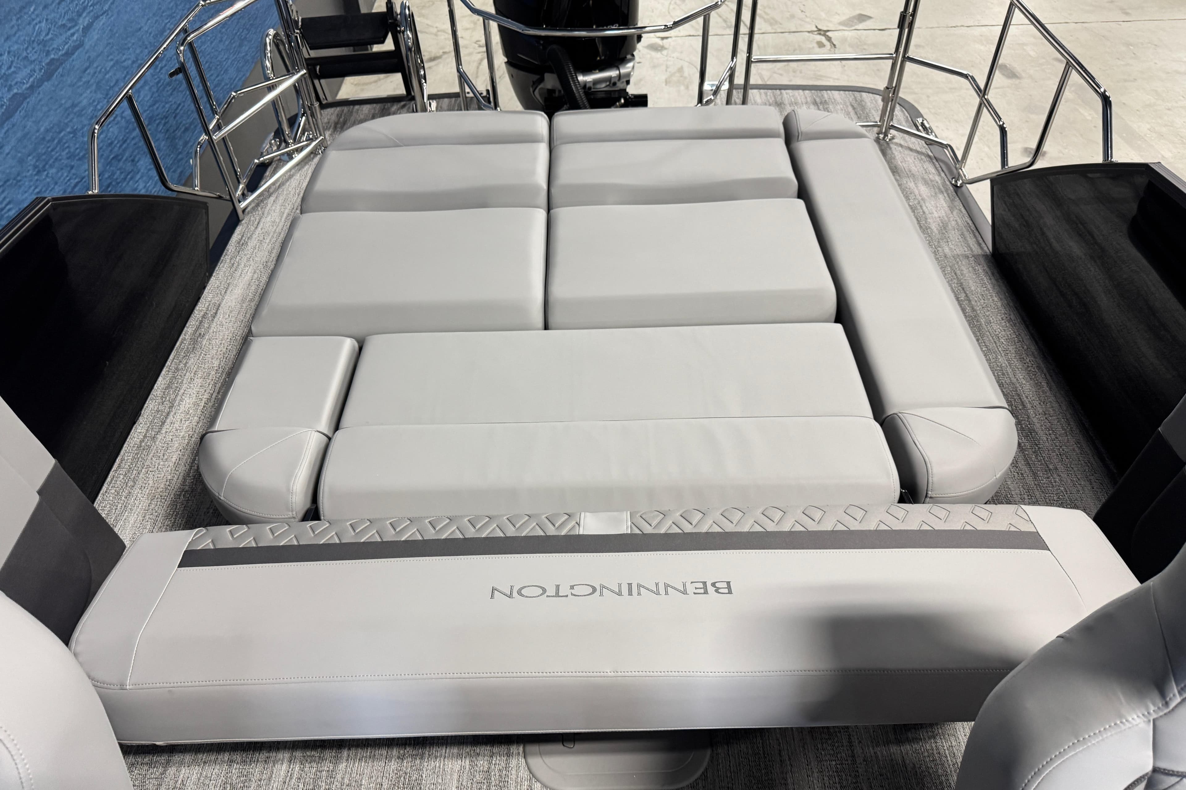 2026 Bennington 26 MCSB boat with luxurious gray seating and sleek design.