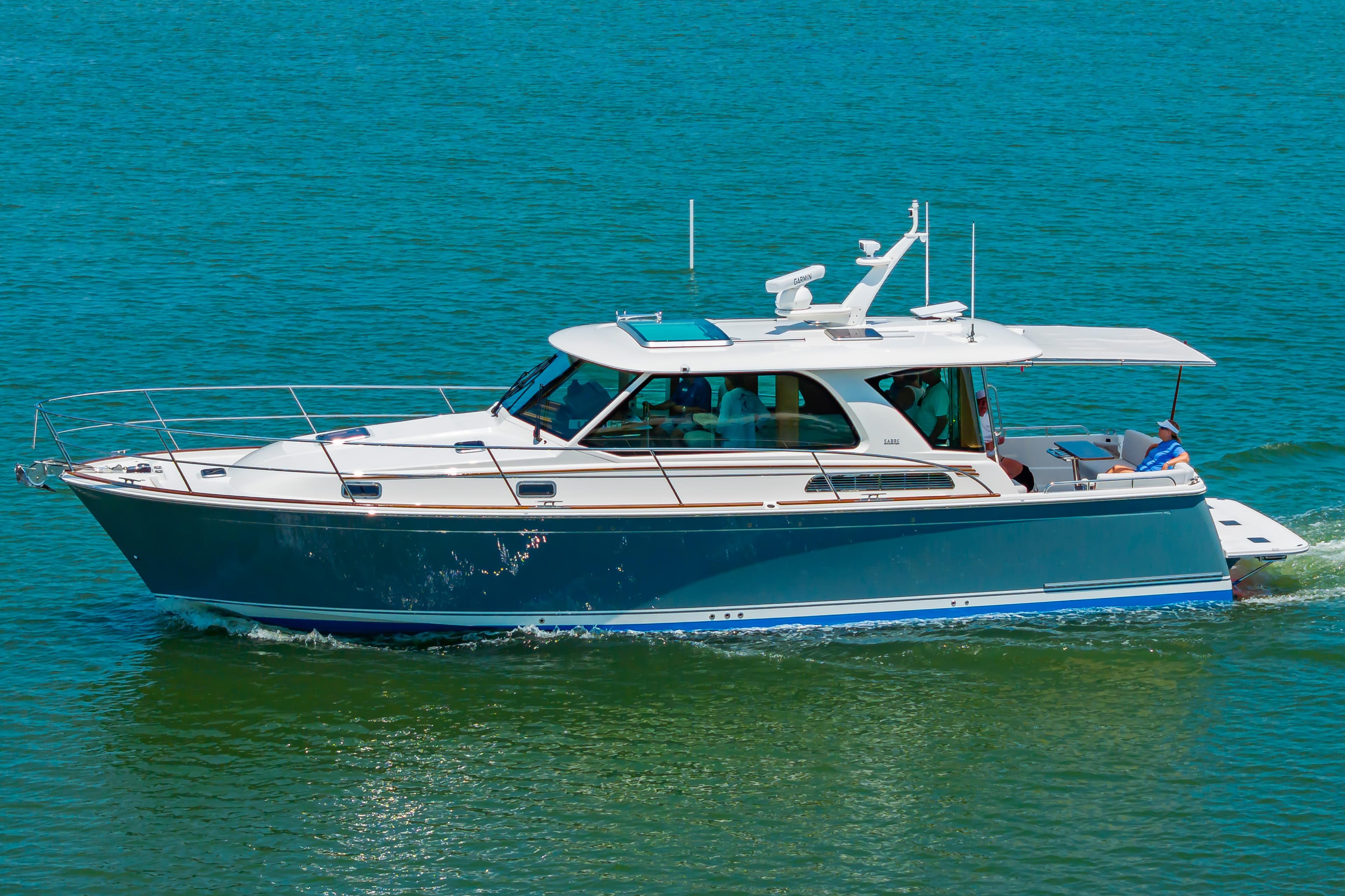 2026 Sabre 43 Salon Express yacht cruising on clear blue water.