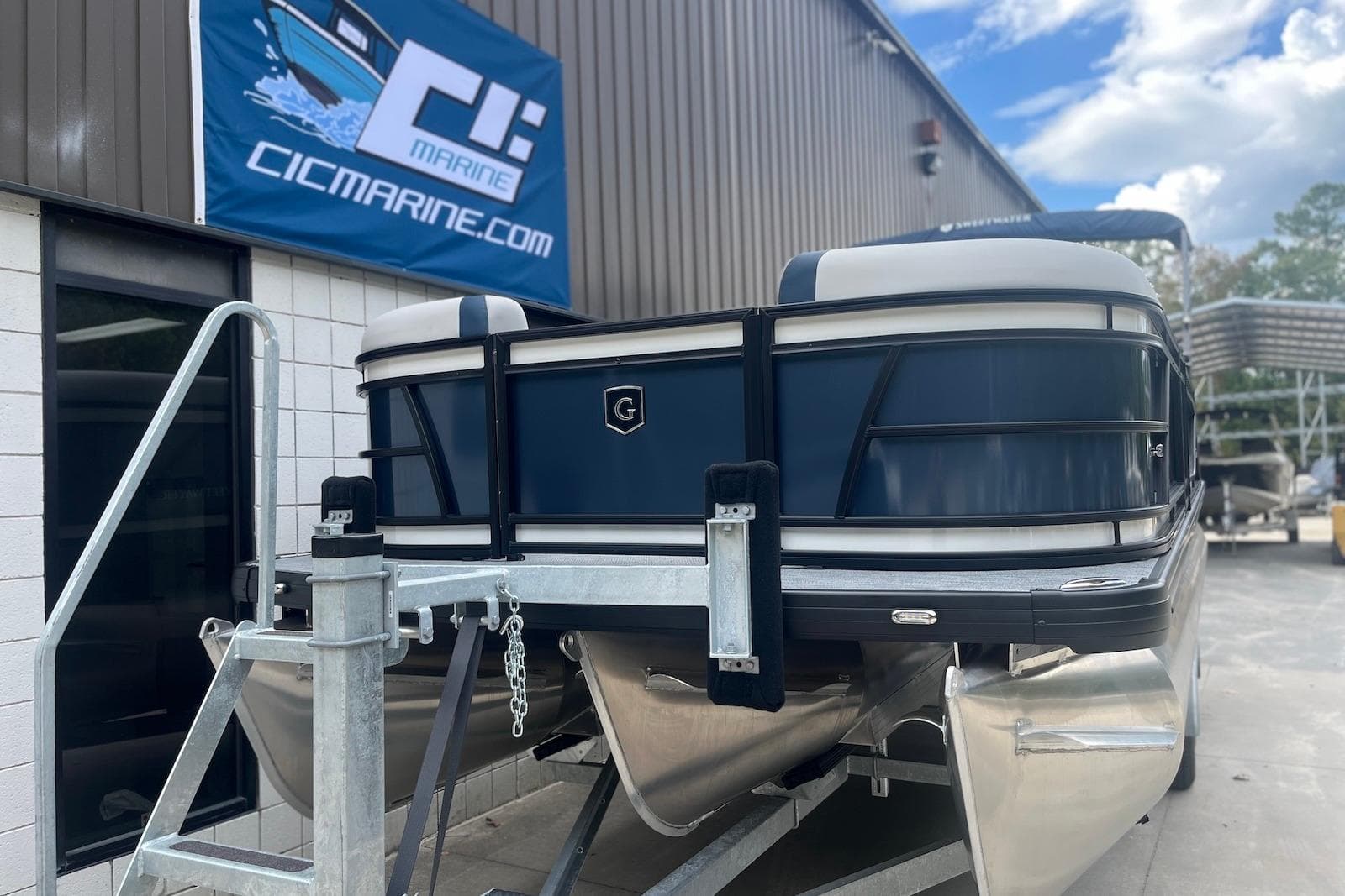 2026 Godfrey SWEETWATER 2286 SFL pontoon boat on trailer at CIC Marine.