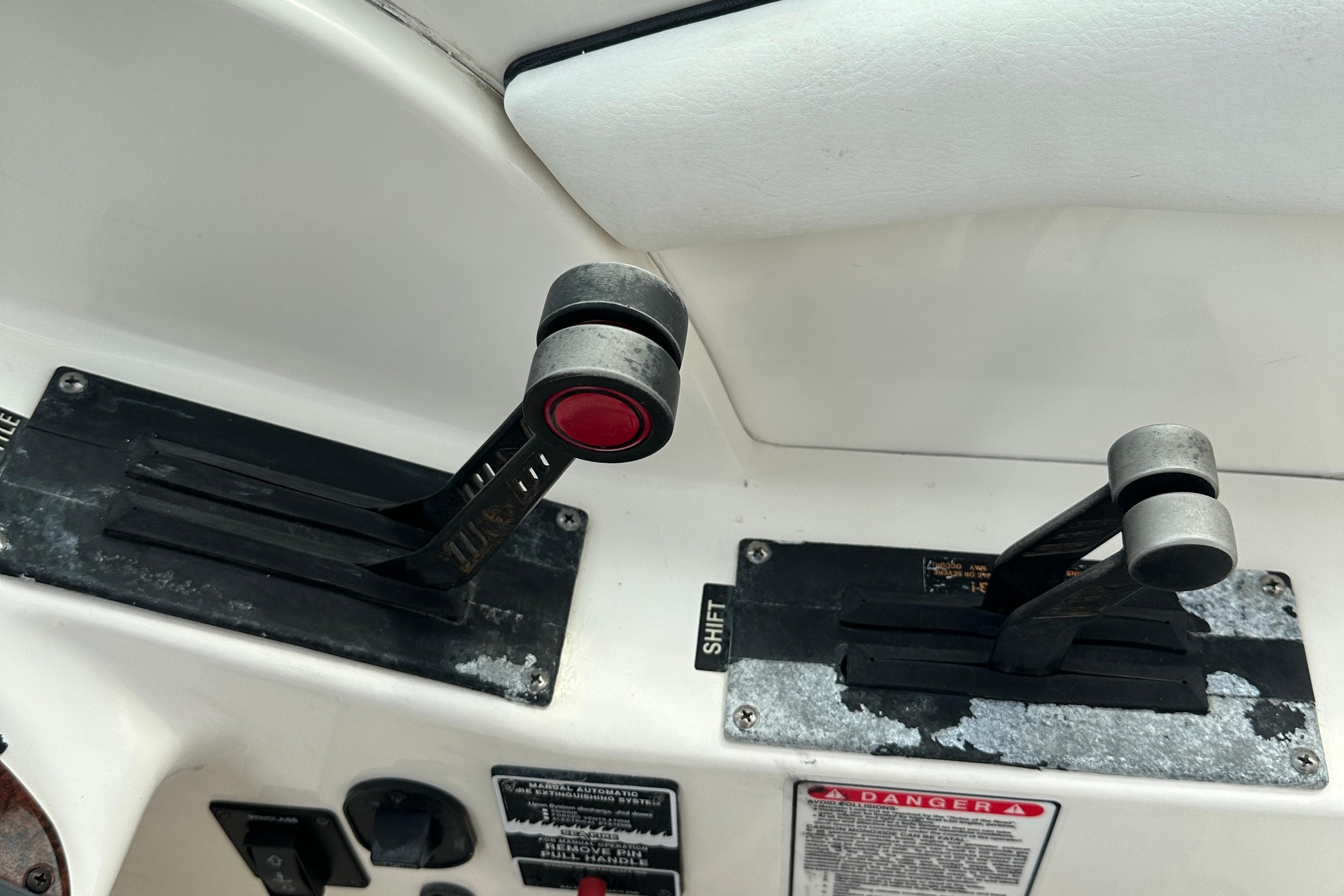 Throttle and shift controls on a 2005 Sea Ray 290 SLX boat dashboard.