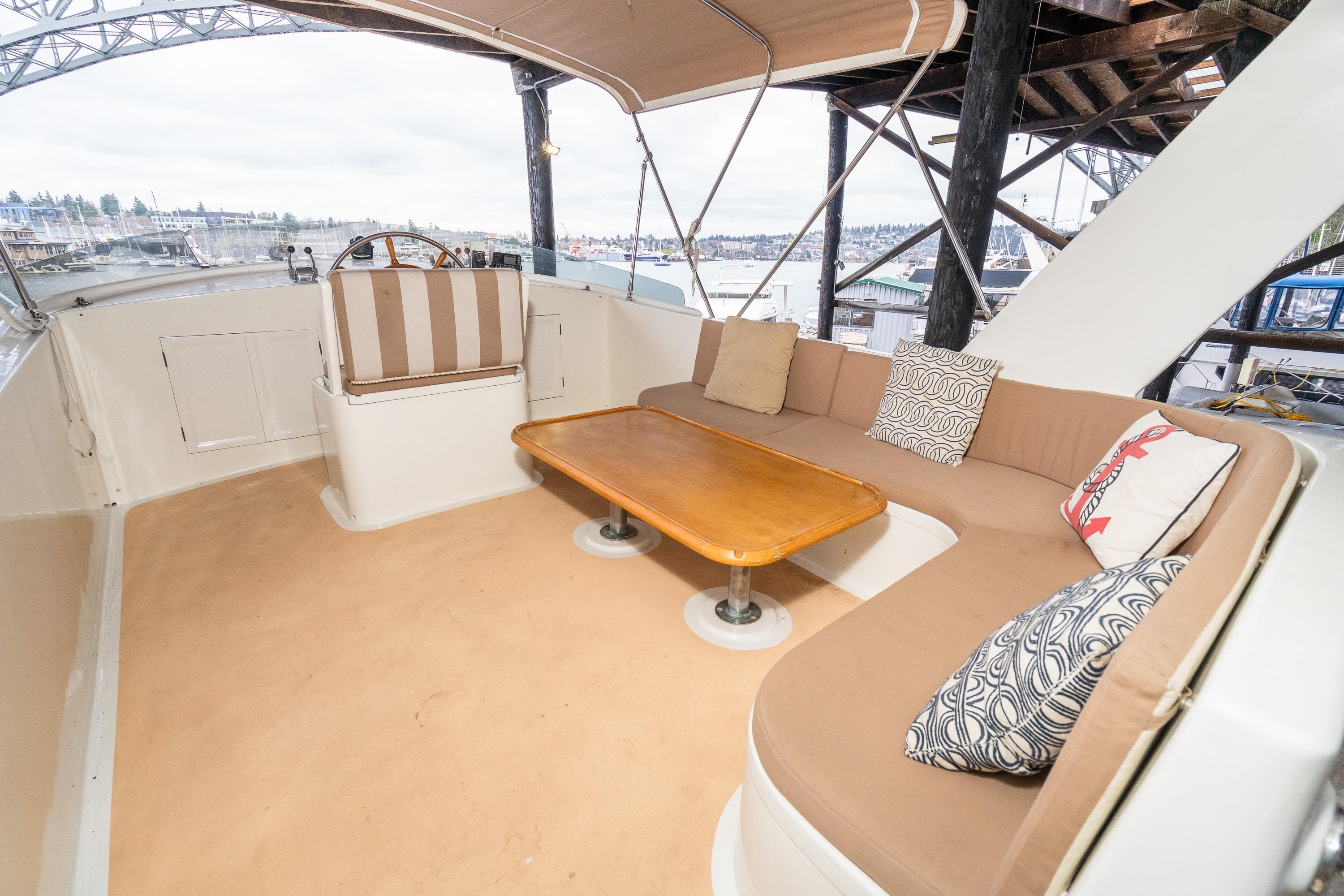 1973 American Marine Alaskan 53 yacht interior with cozy seating and wooden table.