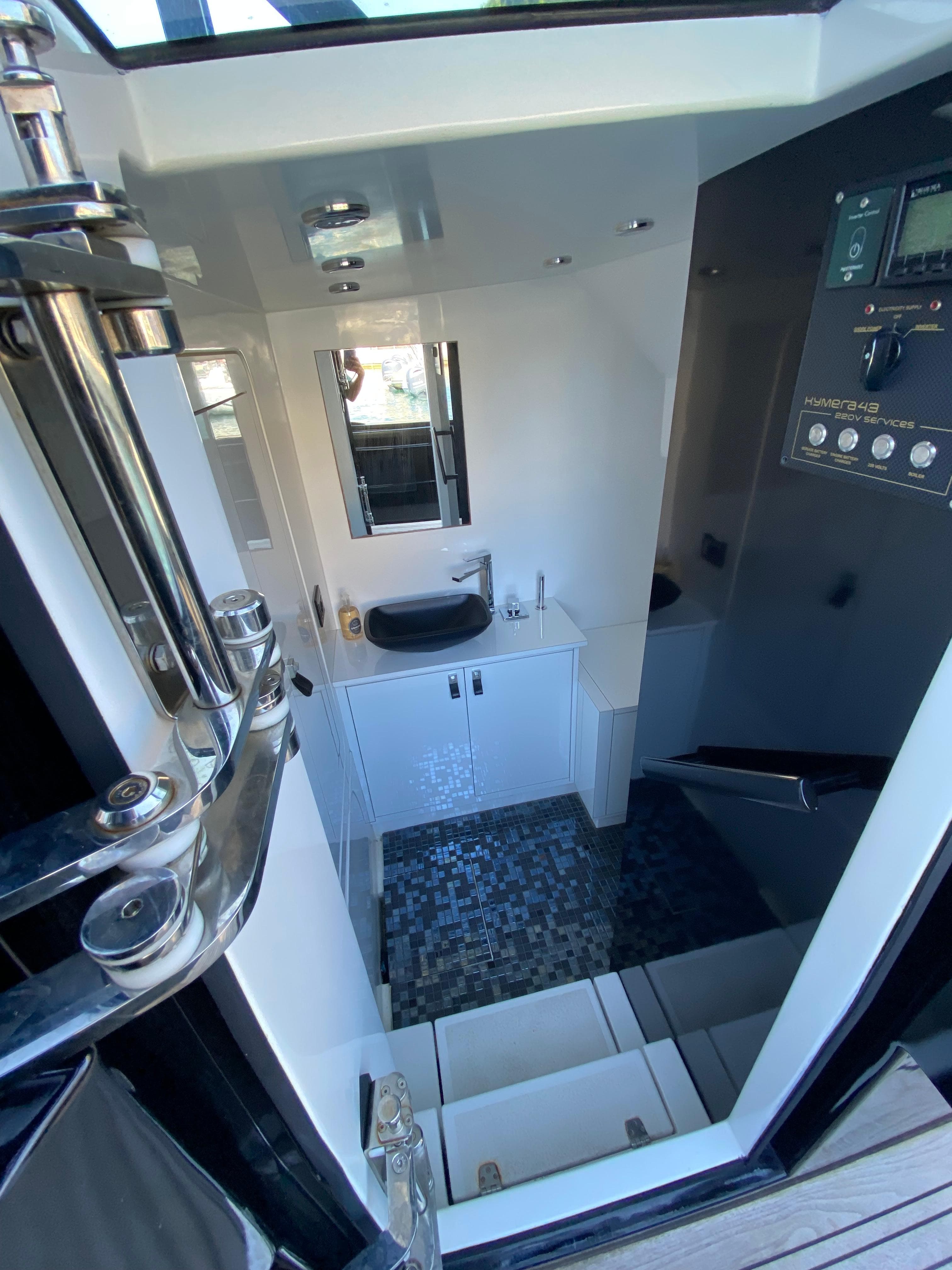Interior view of 2020 Sea Water Kymera 43 yacht bathroom with modern fixtures.