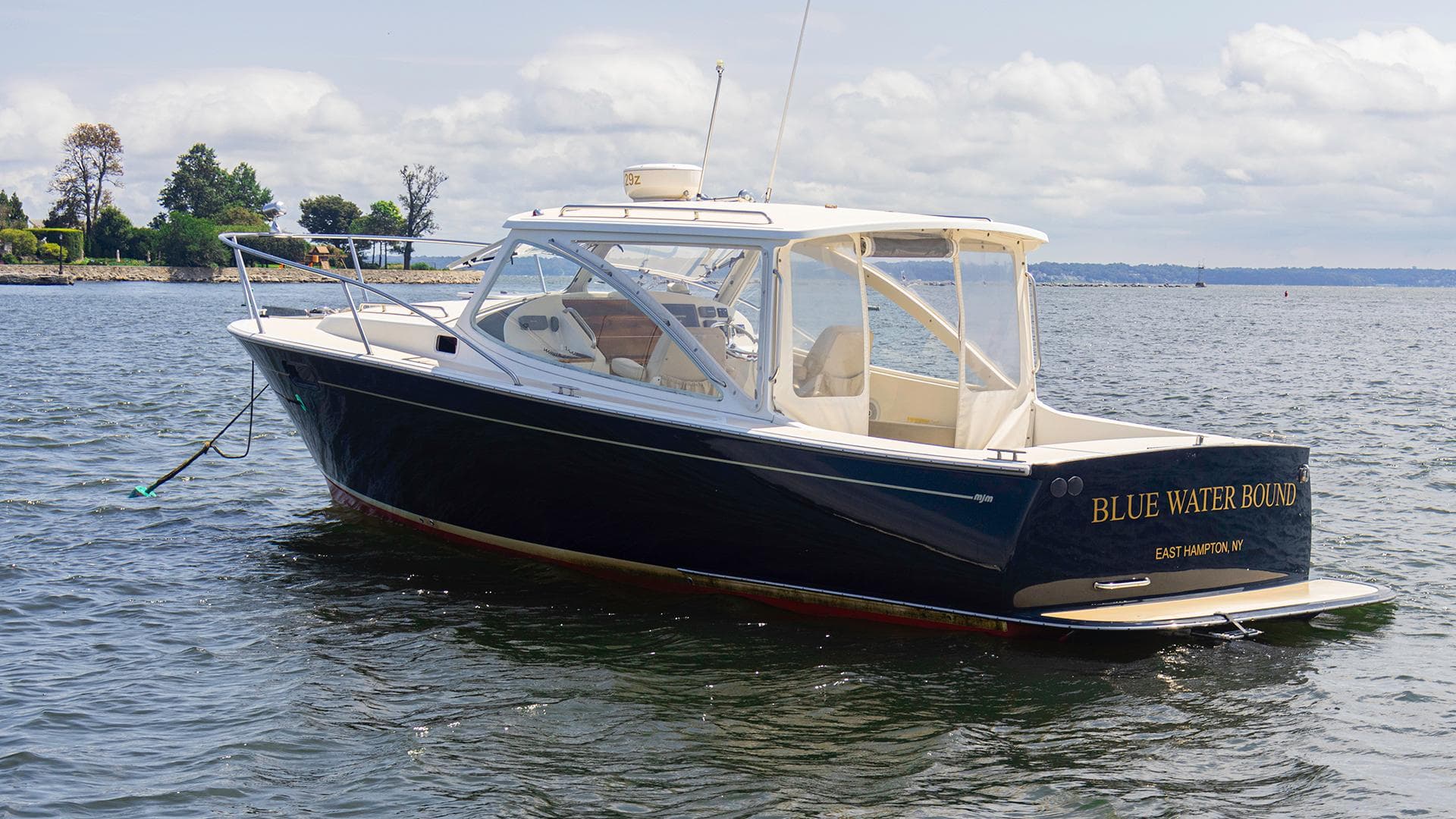 2007 MJM 29z boat named Blue Water Bound on calm waters.