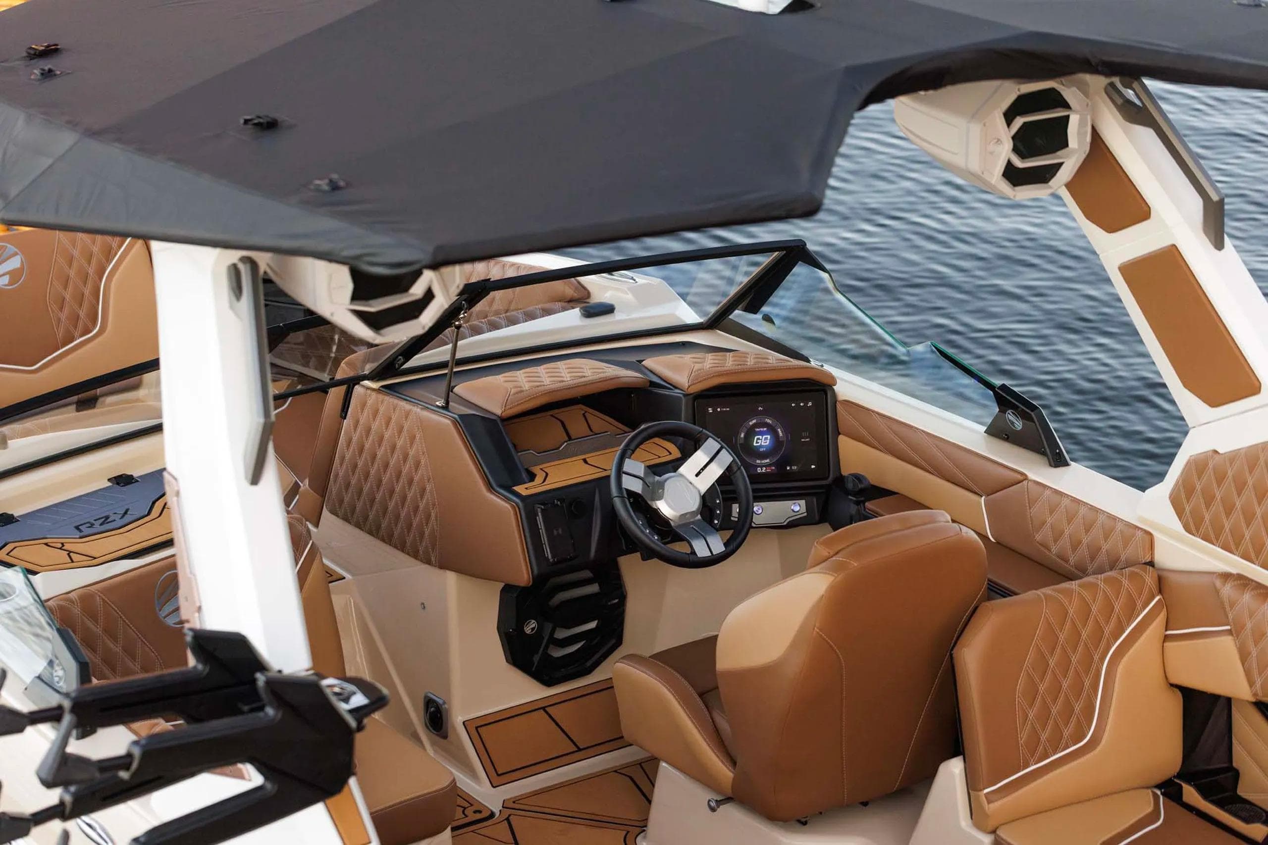 Manufacturer Provided Image: Luxurious interior of 2026 Tigé 22RZX boat with tan leather seating and modern dashboard.