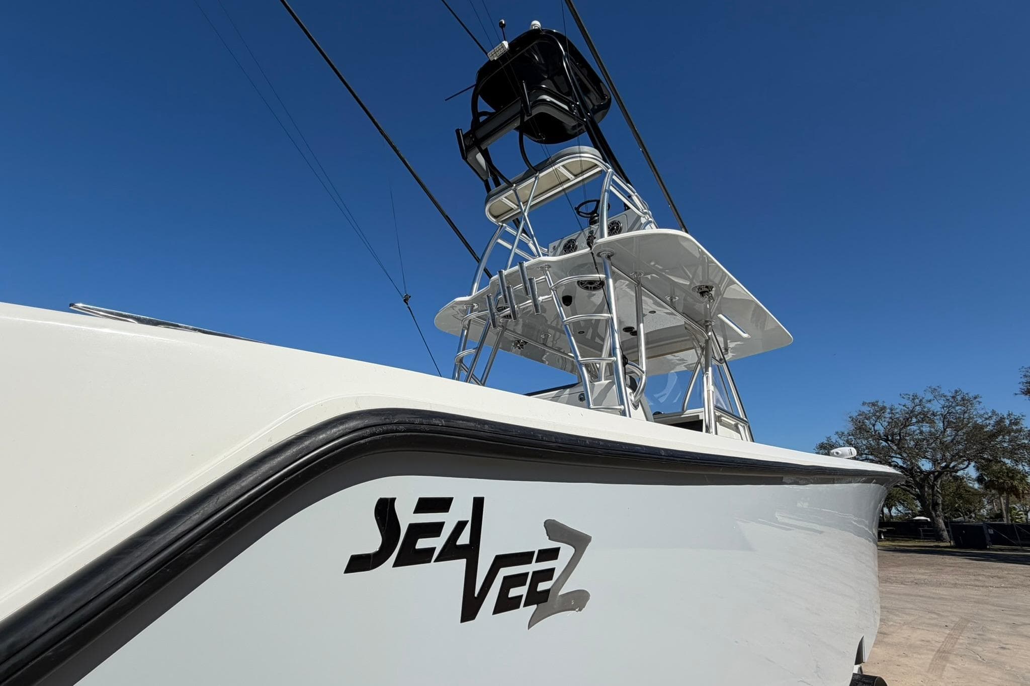 2021 SeaVee 390Z boat with tower against clear blue sky.