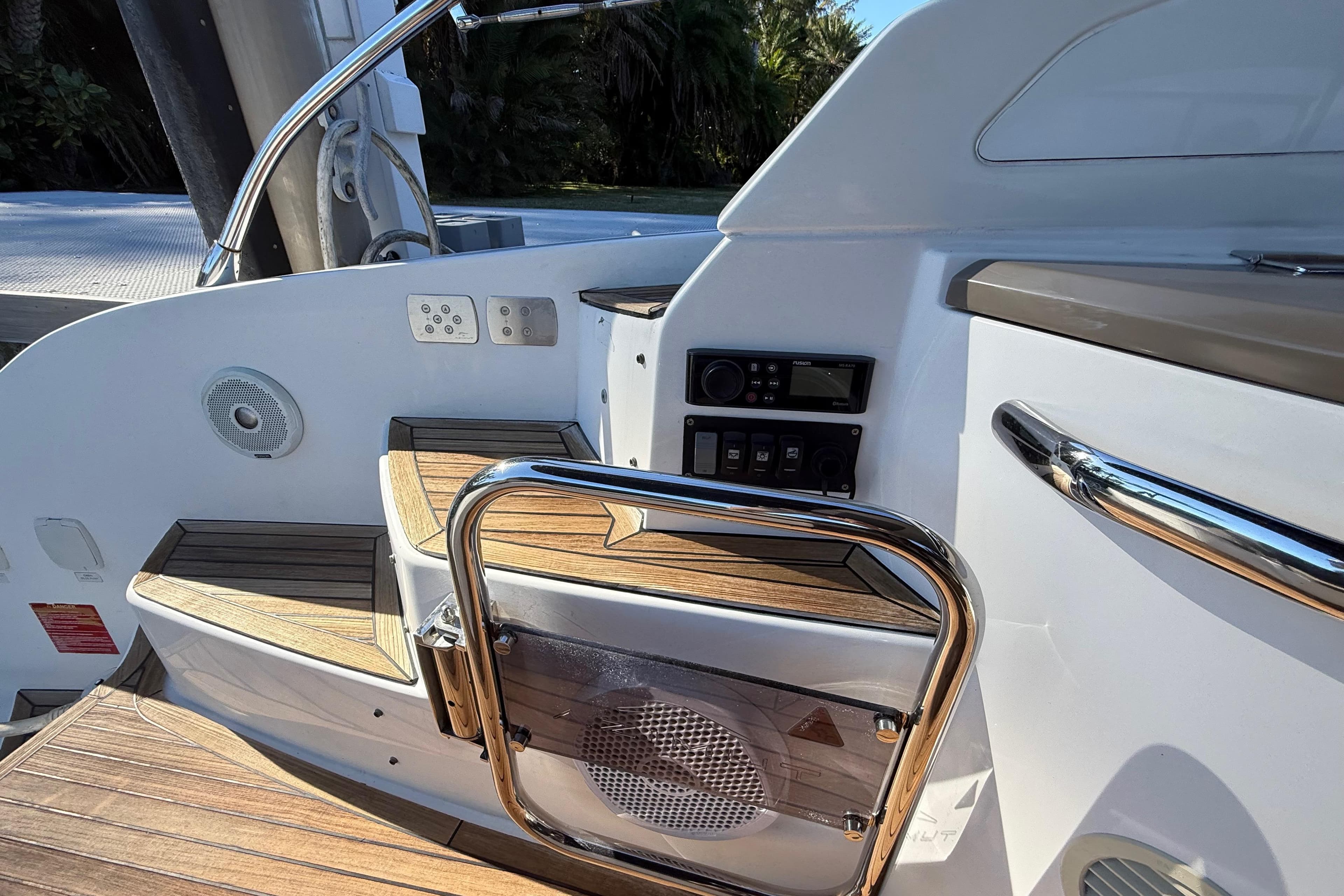 2018 Azimut Atlantis 43 yacht interior with wooden steps and control panel.