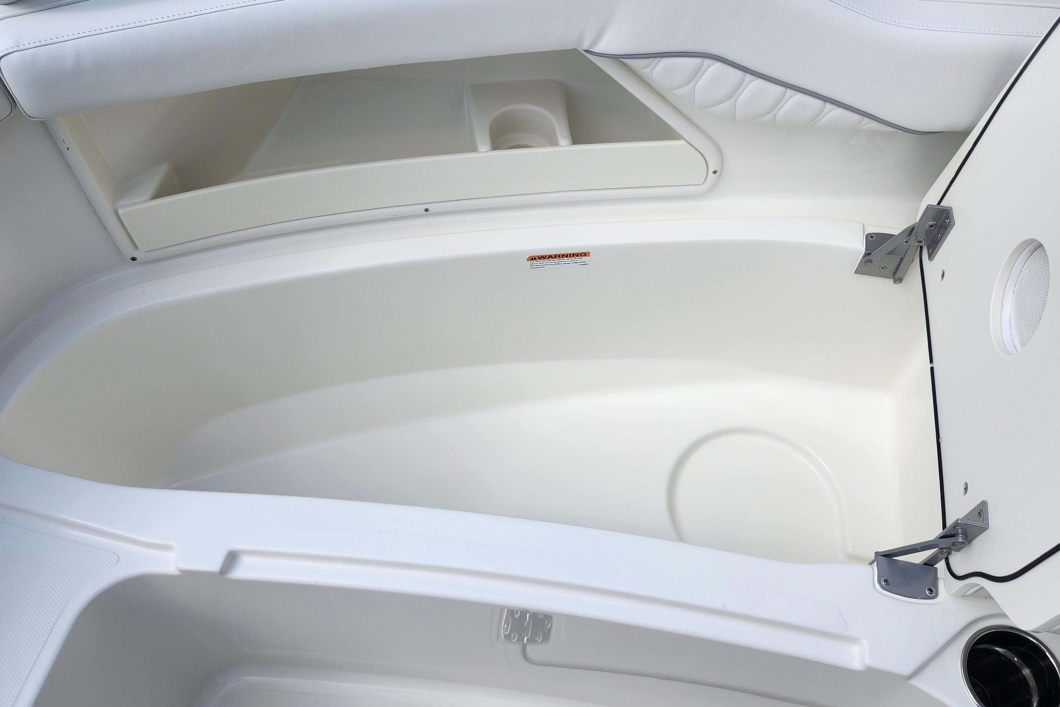 Interior storage compartment of 2026 Pursuit DC 286 Dual Console boat.