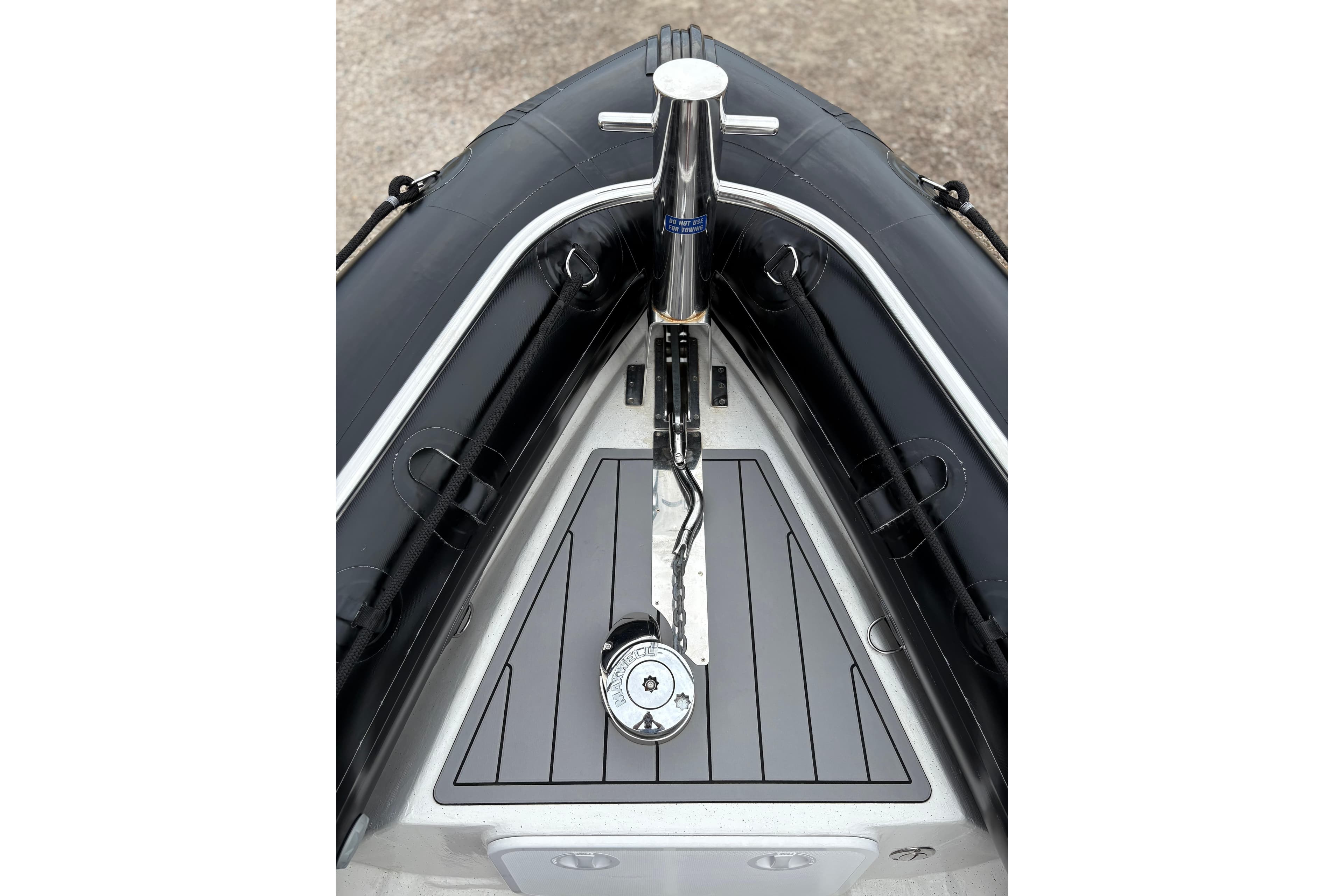 2020 Protector 310 Targa boat bow with sleek black and gray design.